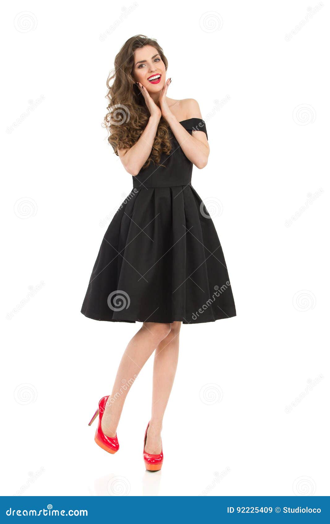 https://thumbs.dreamstime.com/z/delighted-elegant-woman-black-dress-red-high-heels-beautiful-young-cocktail-standing-one-leg-holding-head-hands-92225409.jpg