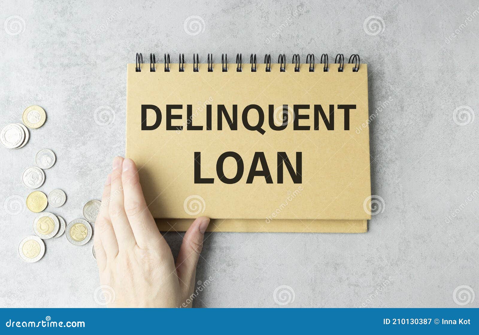 Delinquent Loan Text on Notepad with Hand Stock Image Image of