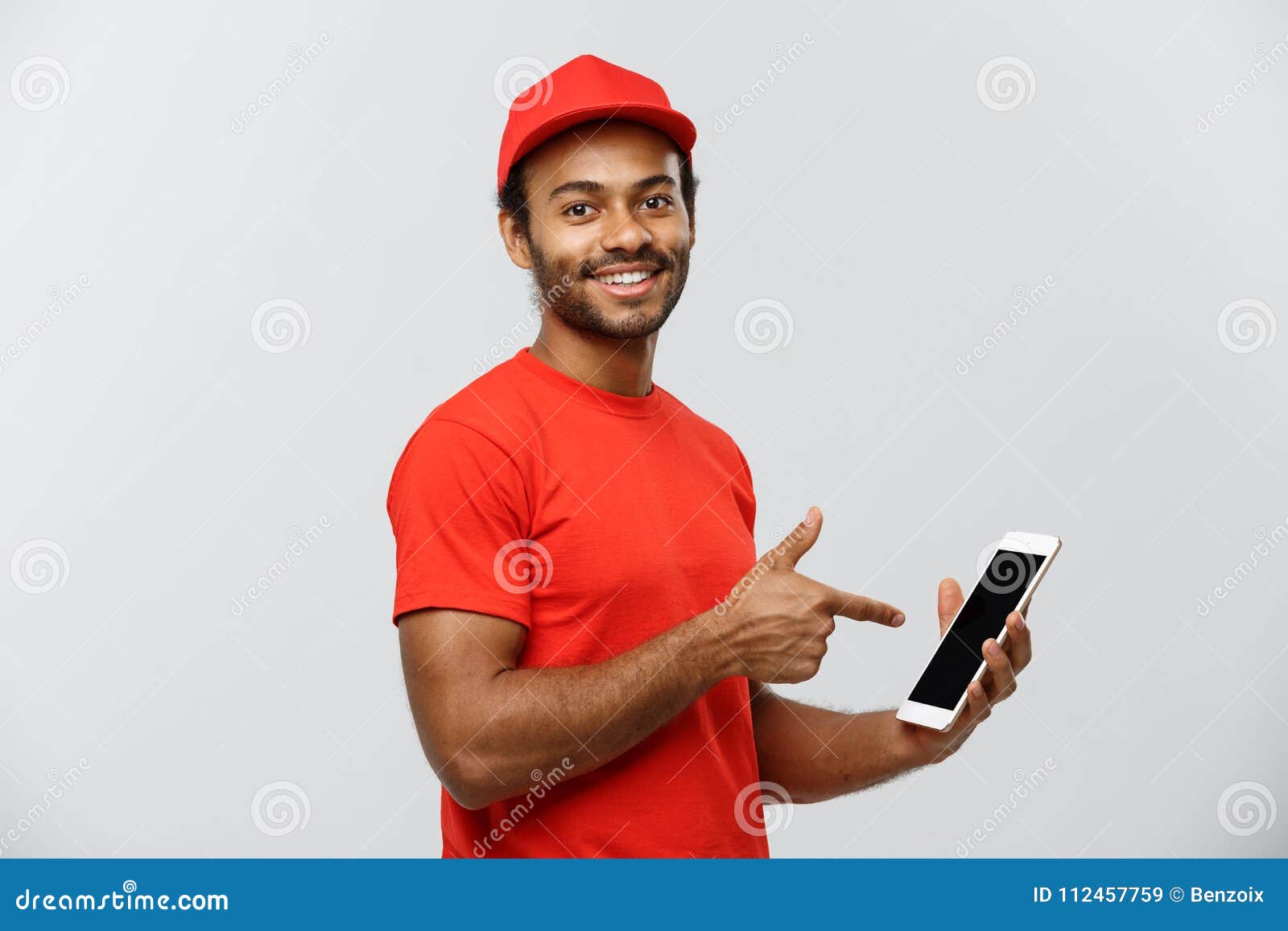 delivery concept - portrait of handsome african american delivery man or courier showing tablet on you to check the