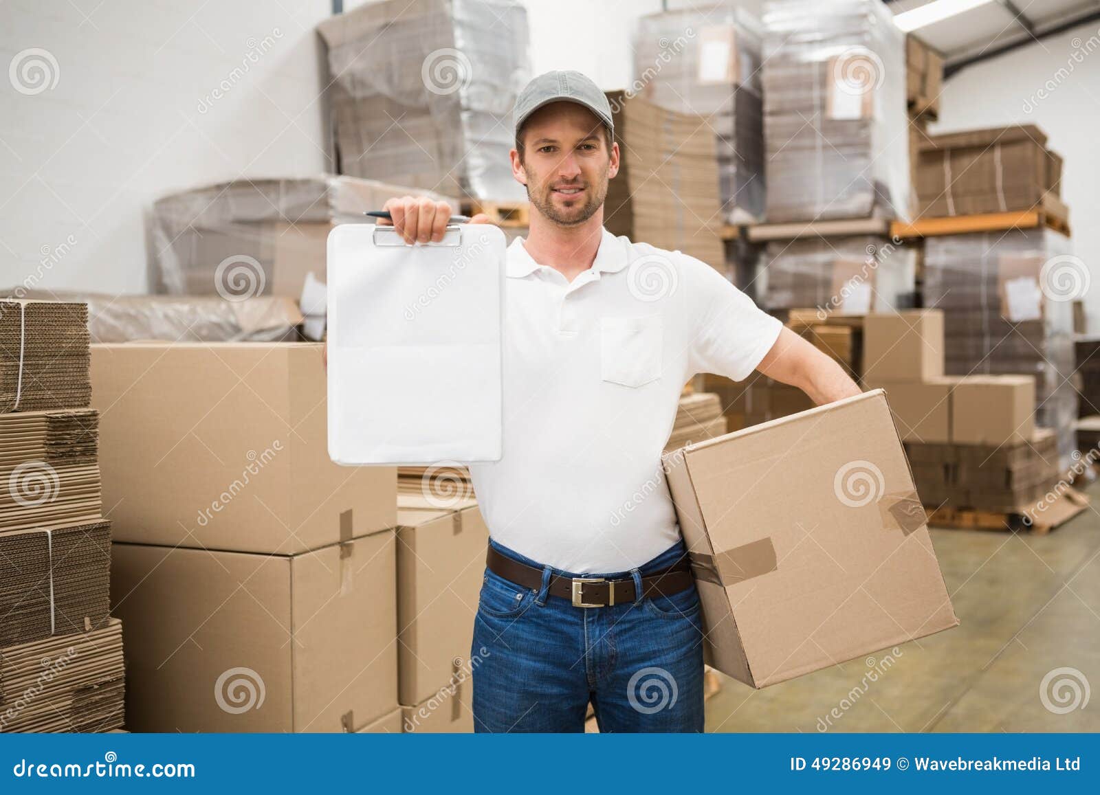 Delivery Man with Box and Clipboard in Warehouse Stock Image Image of