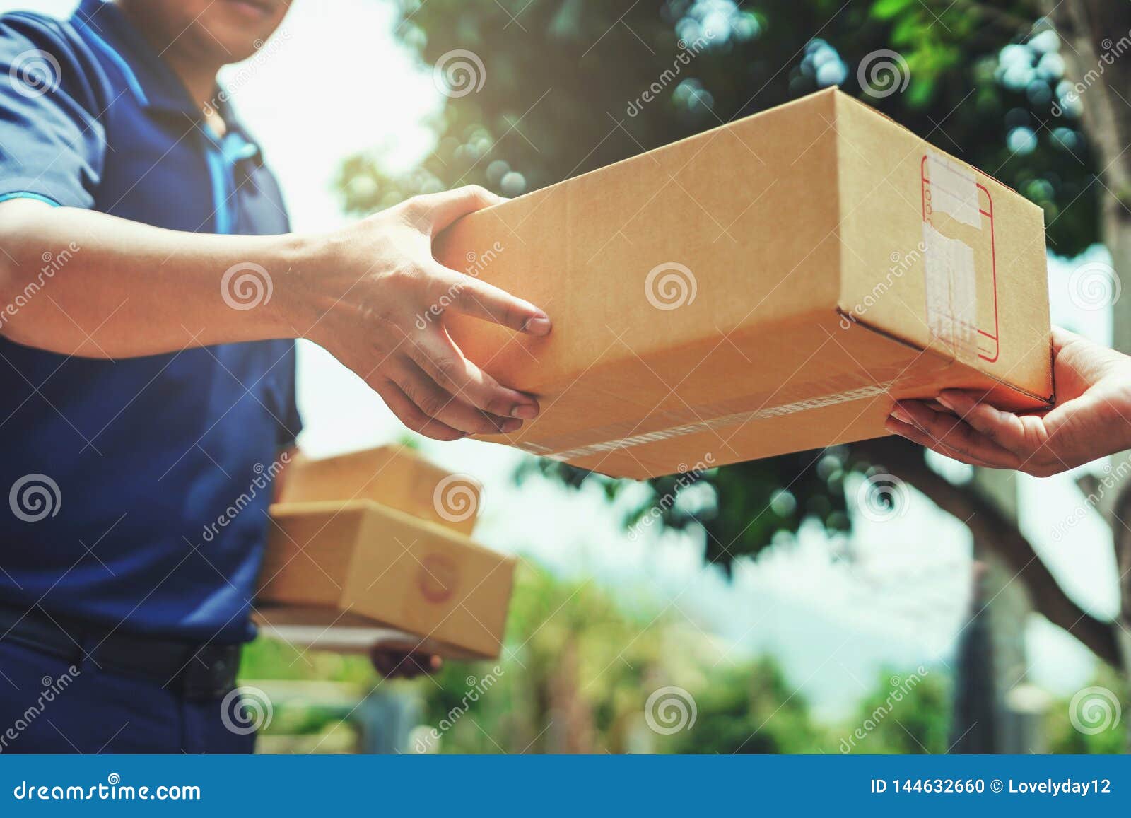 delivery man delivering holding parcel box