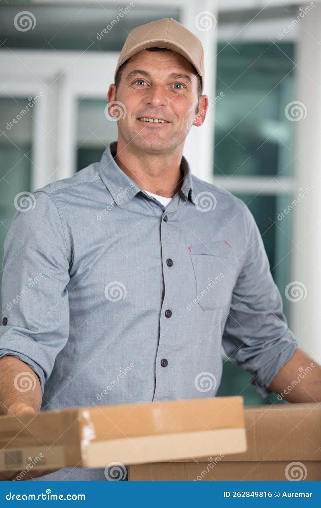 Delivery Man Giving Cardboard Box Stock Photo Image of uniform
