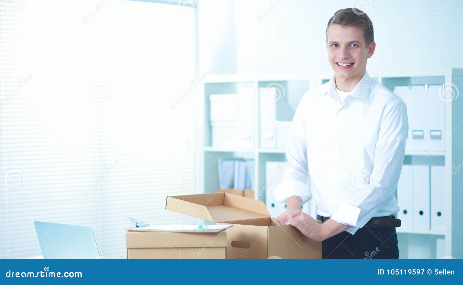 Delivery Man with Parcel and a Tablet Standing in Office Stock Image - Image of uniform, young ...