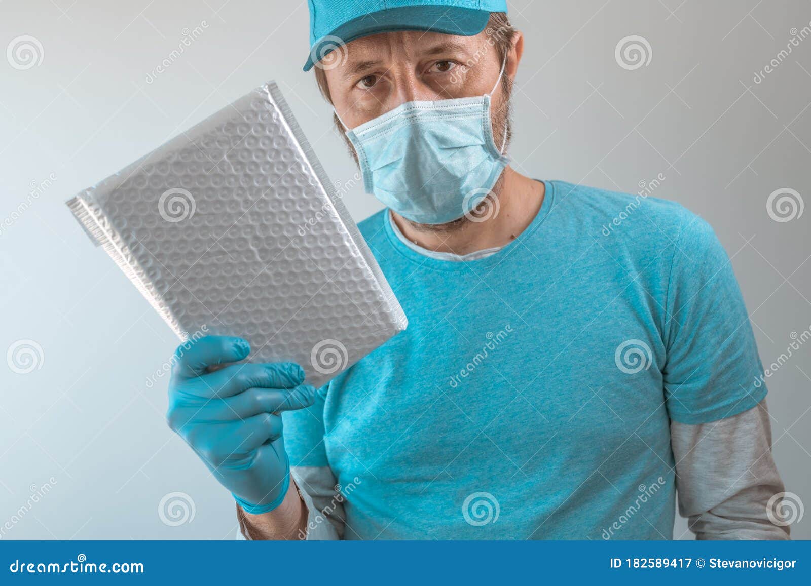 Delivery Man Posing with Parcel Package in Protective Clothing Stock Image Image of posted