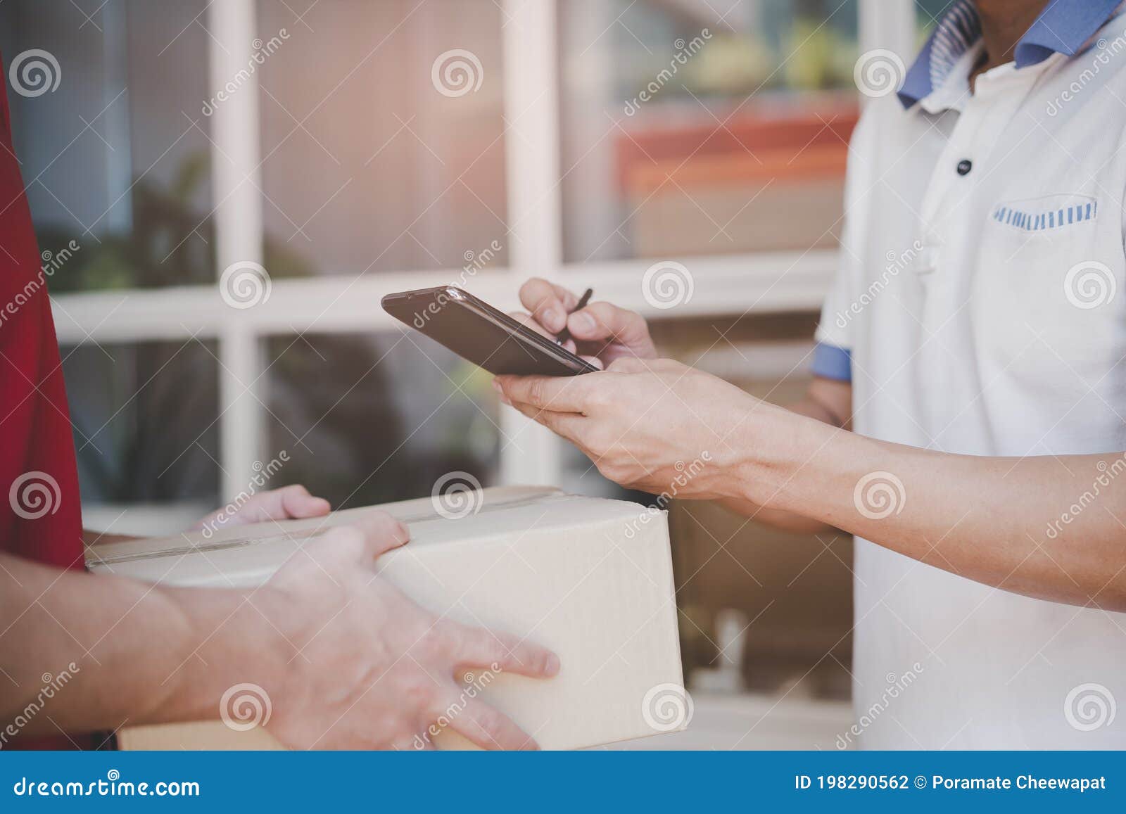 Delivery Man Sending Package To Receiver on Doorway Stock Photo Image