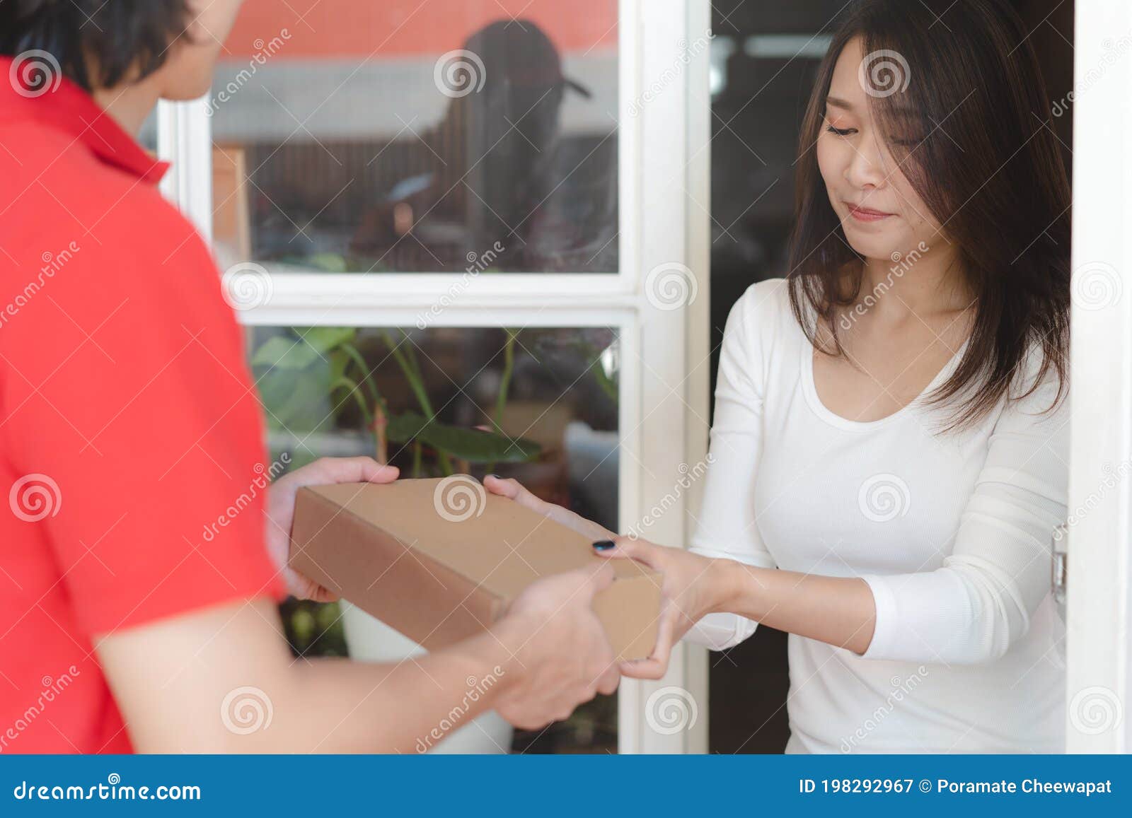 Delivery Man Sending Package To Receiver on Doorway Stock Image Image