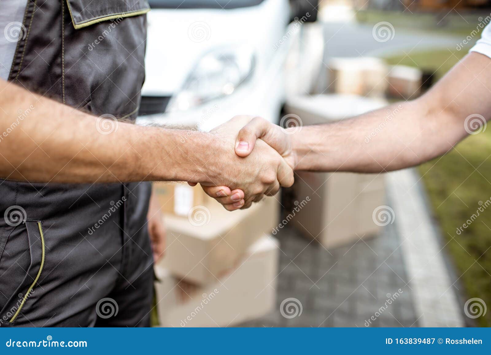 Delivery Men Shaking Hands, Closeup Stock Image Image of people