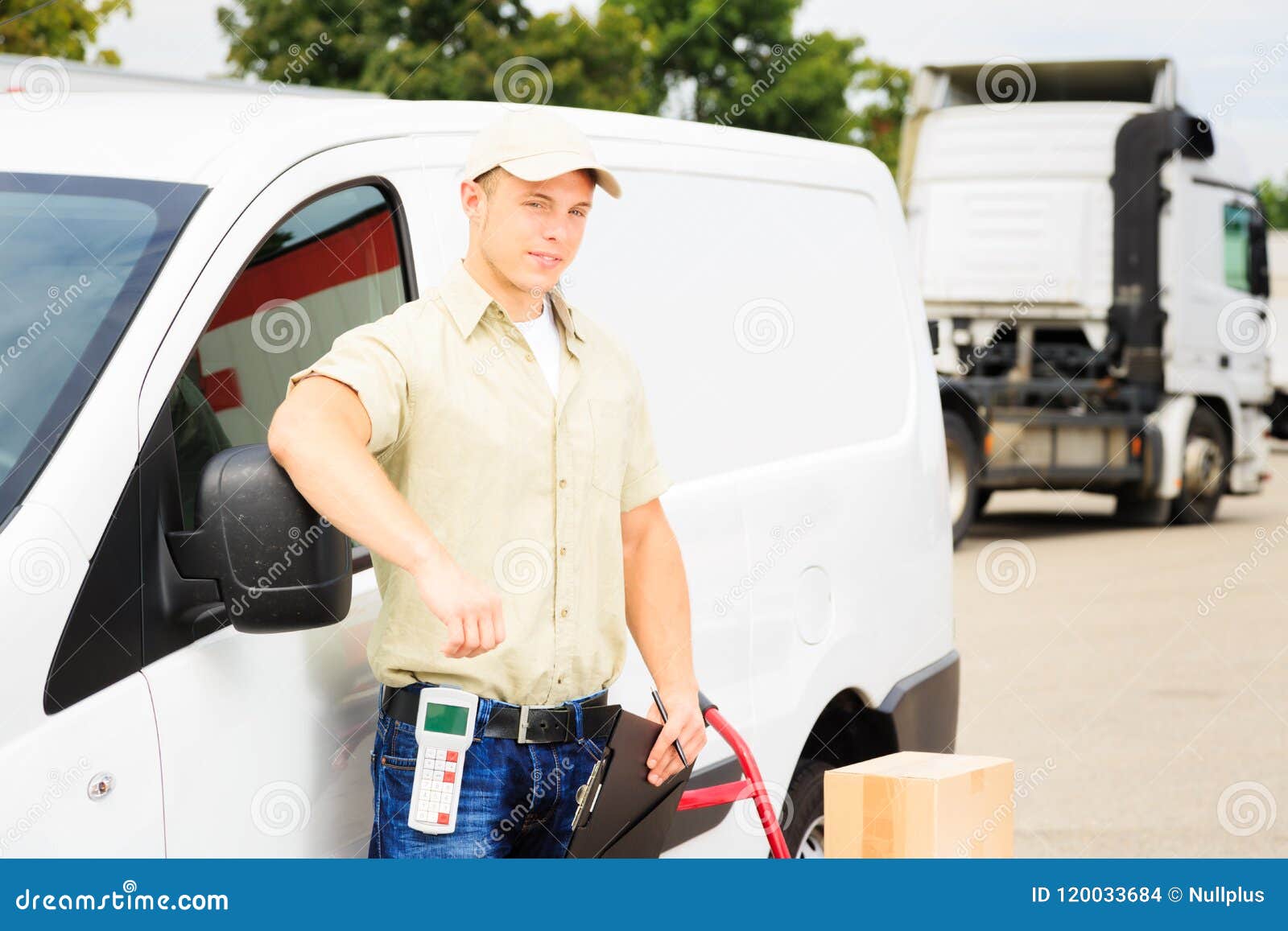 Delivery Boy Standing Next To His Van 