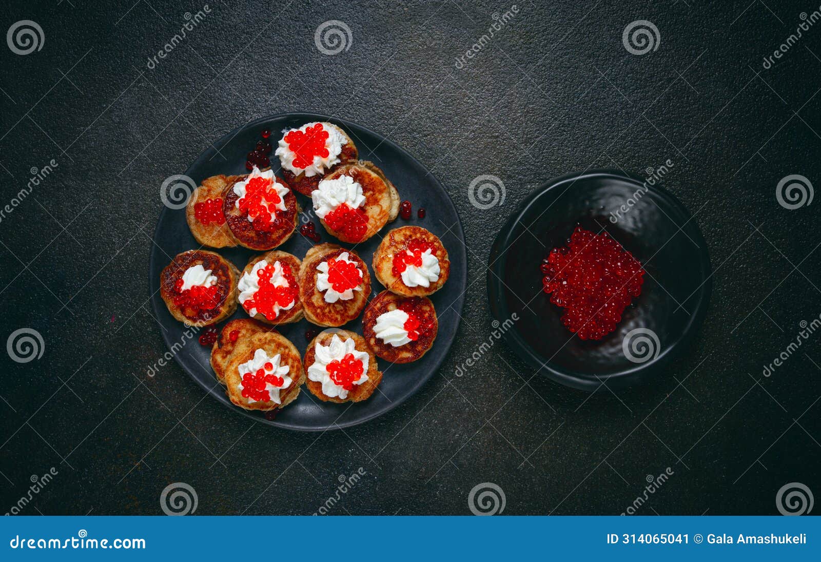 demidoff pancakes, mini pancakes, with sour cream and red caviar, crepes. homemade, no people,