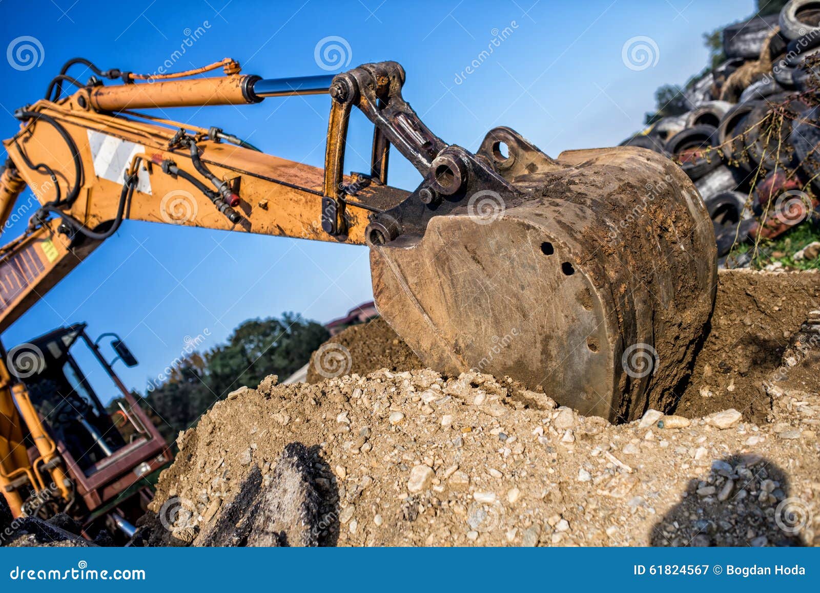 demolishing operations at industrial construction site. worker using bulldozer wrecking