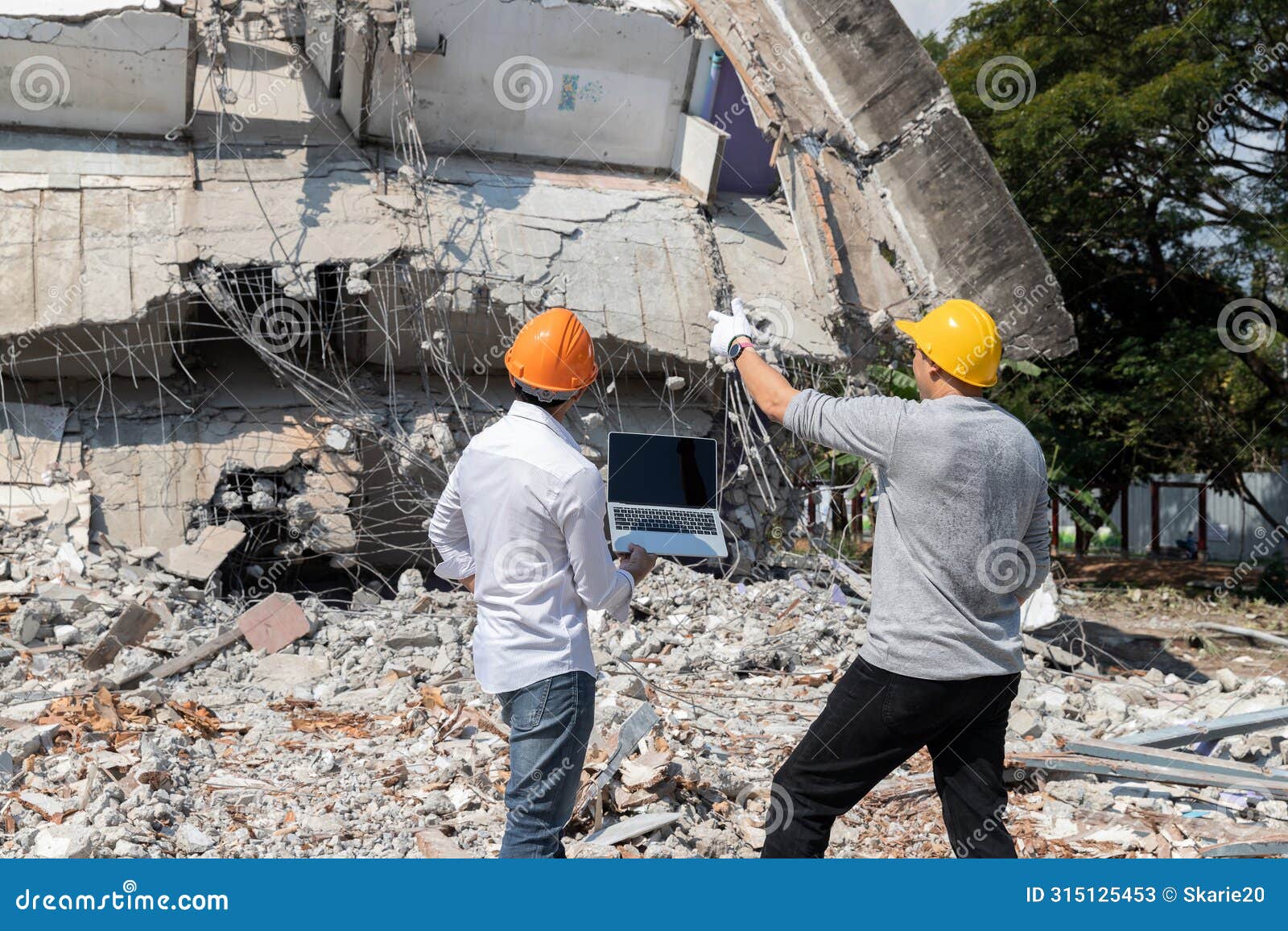 demolition control supervisor and contractor discussing on demolish building