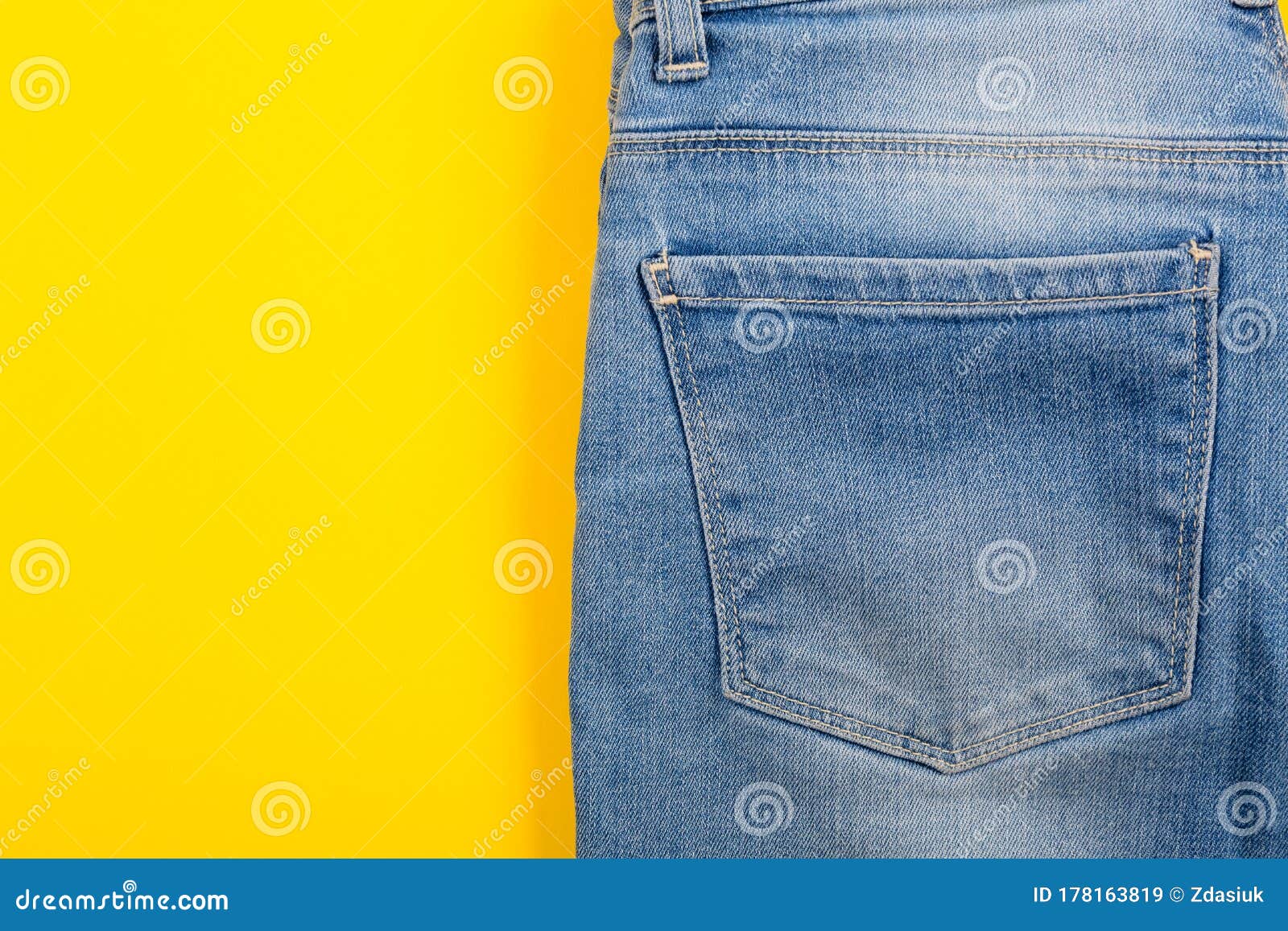 Denim Jeans with Bright Texture on the Yellow Background. the Modern ...