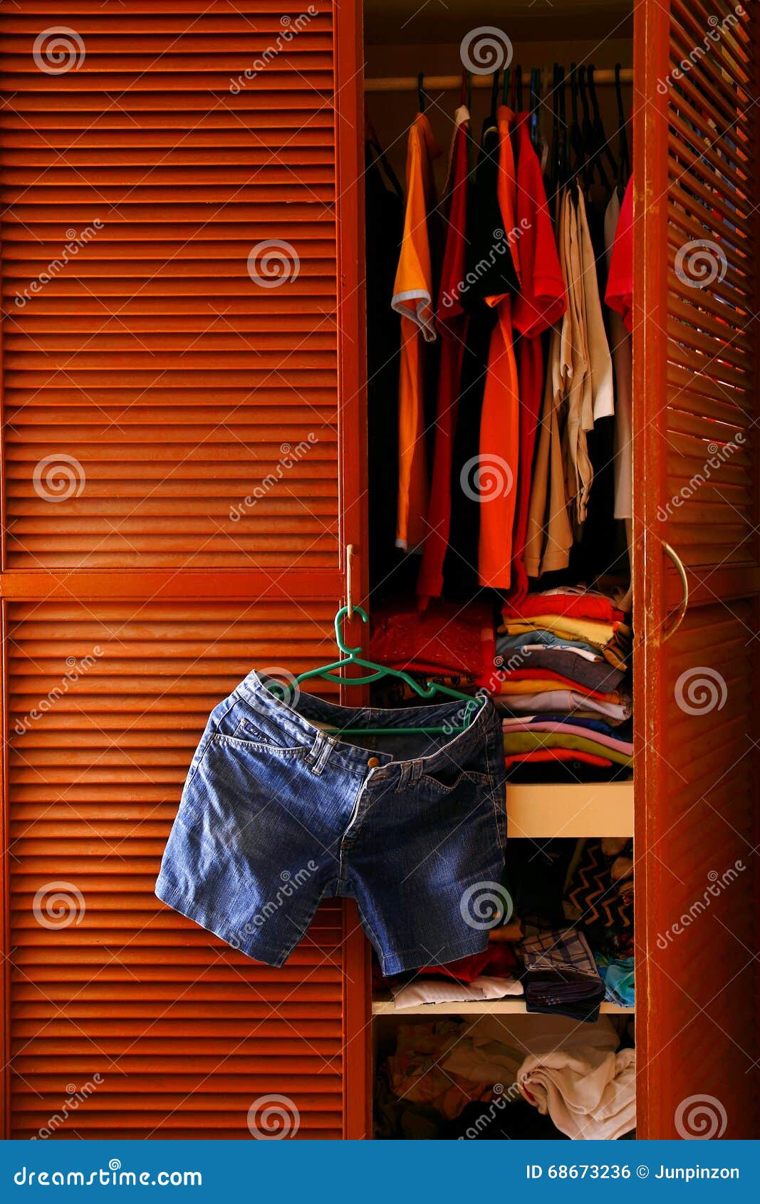 Denim Shorts Hanging By A Clothes Cabinet Door Stock Photo Image