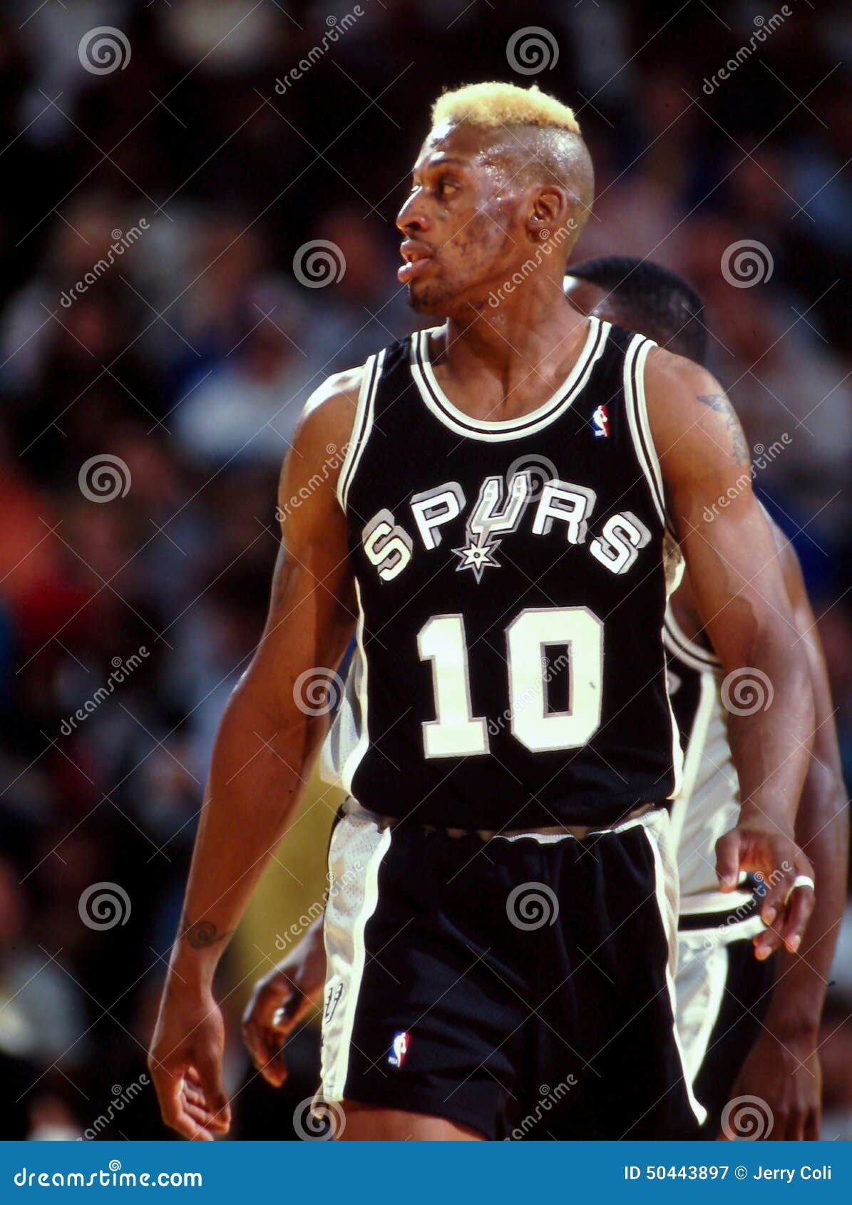 Dennis Rodman of the San Antonio Spurs looks on during a NBA