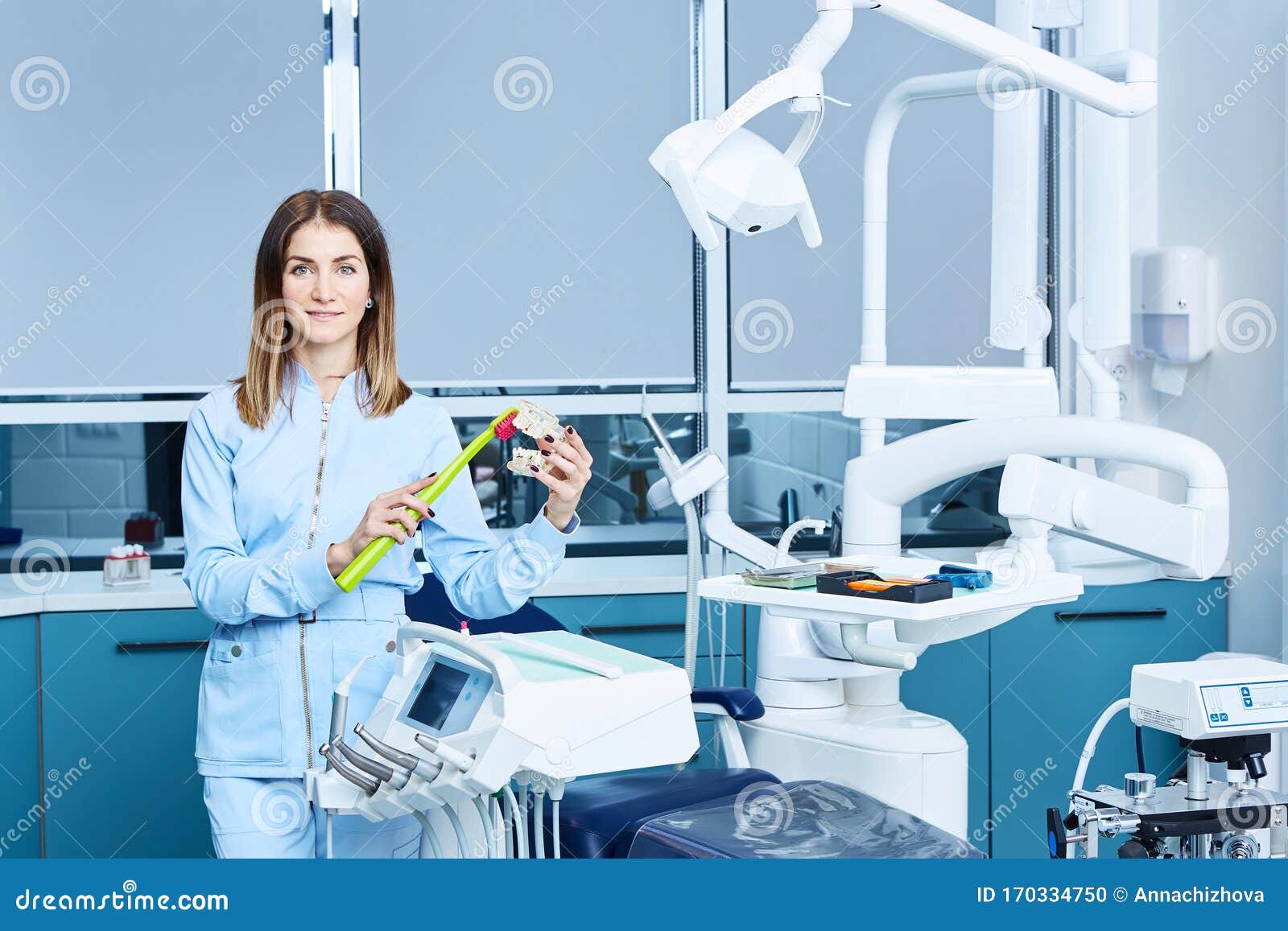 The Dental Assistant in Exam Room Smiling Stock Photo Image of
