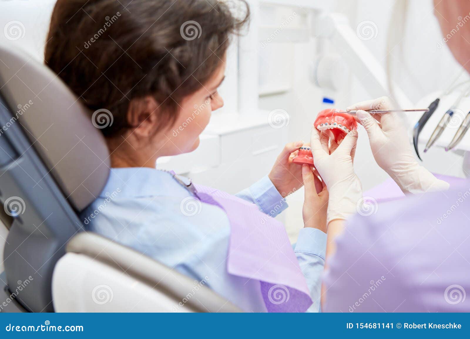 Dental Assistant Explains the Effect of the Braces Stock Image Image