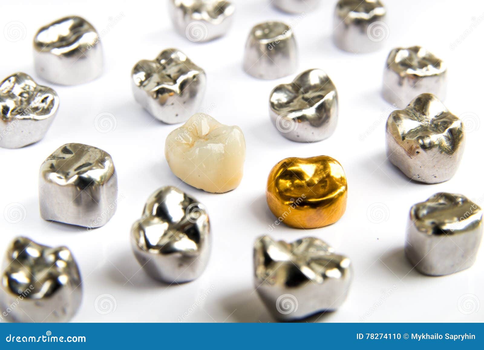 dental ceramic, gold and metal tooth crowns on white background.