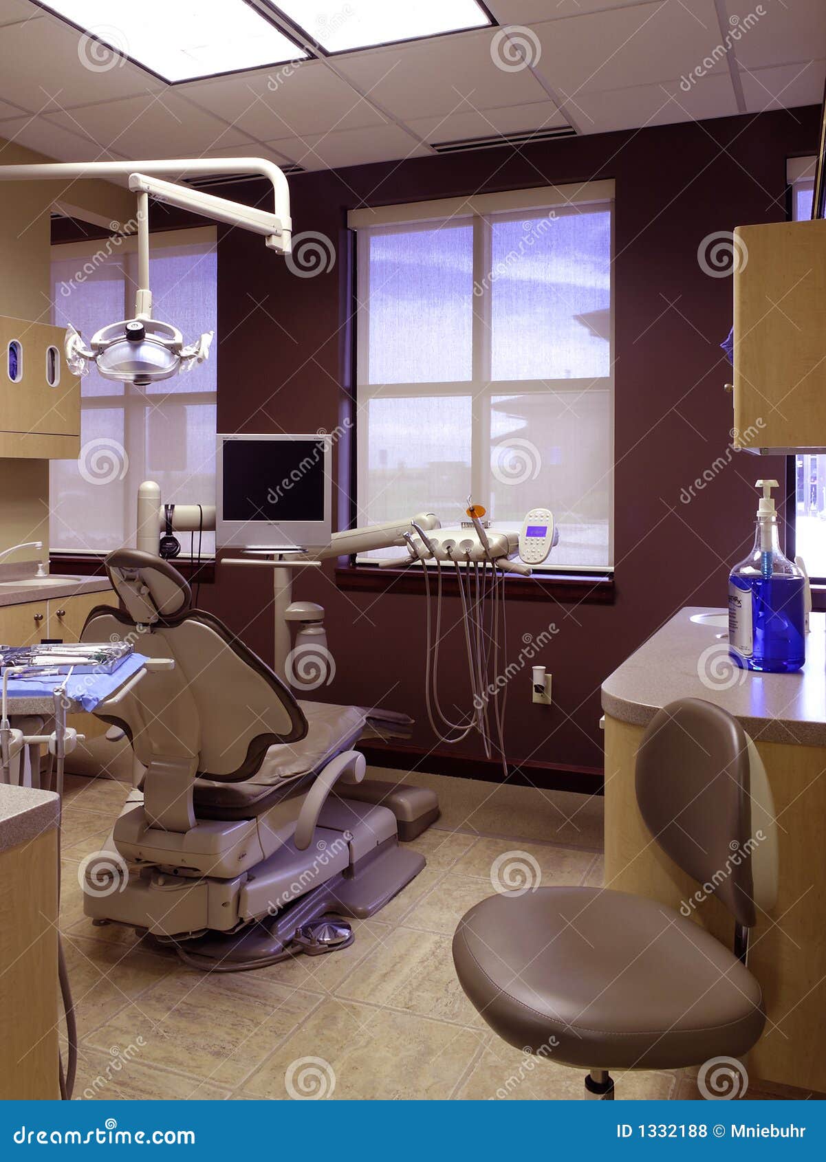 Dental Exam Room Empty Patient Chair And Light Stock Photo