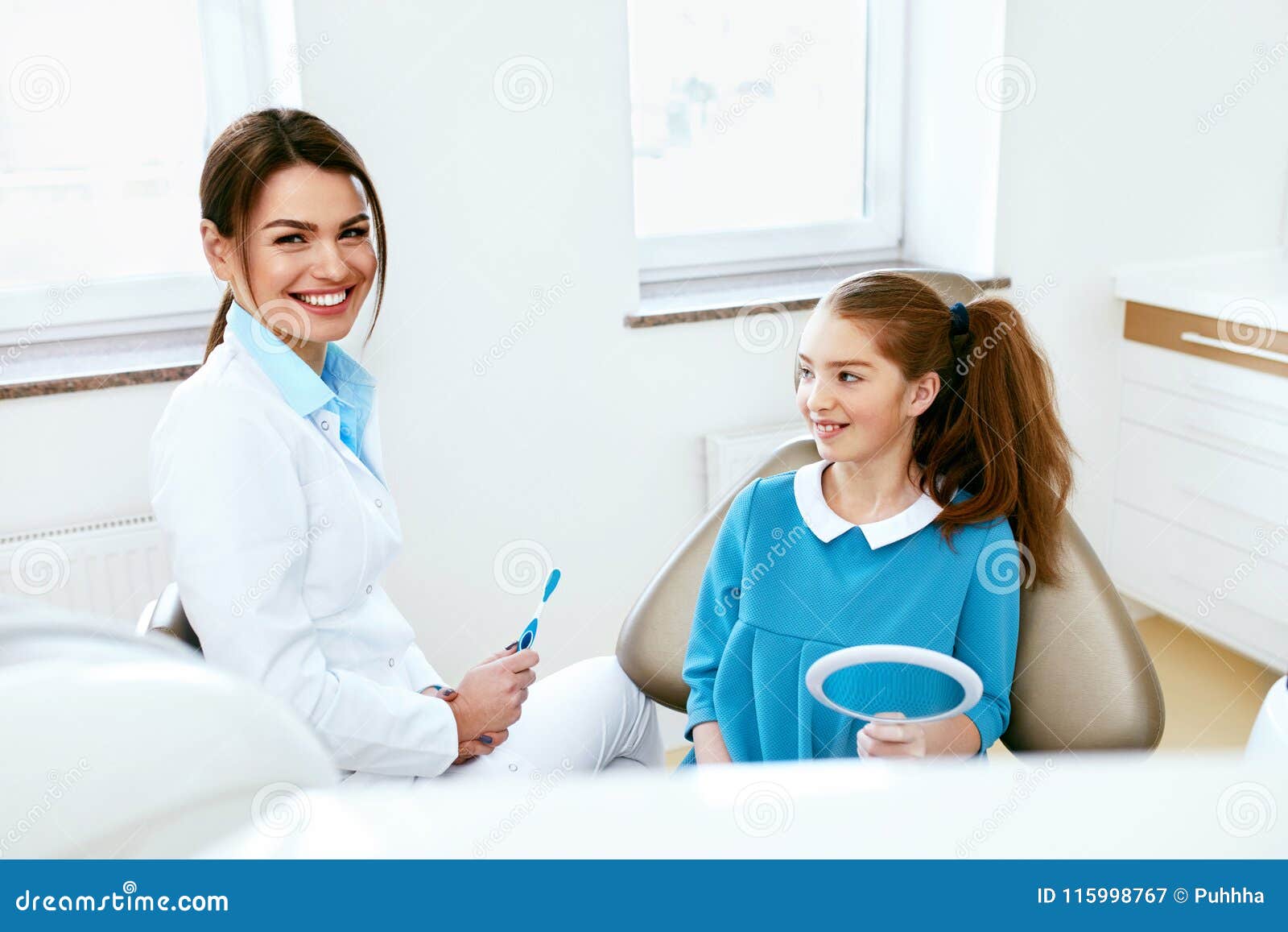 dental health. dentist and happy girl in dentistry office