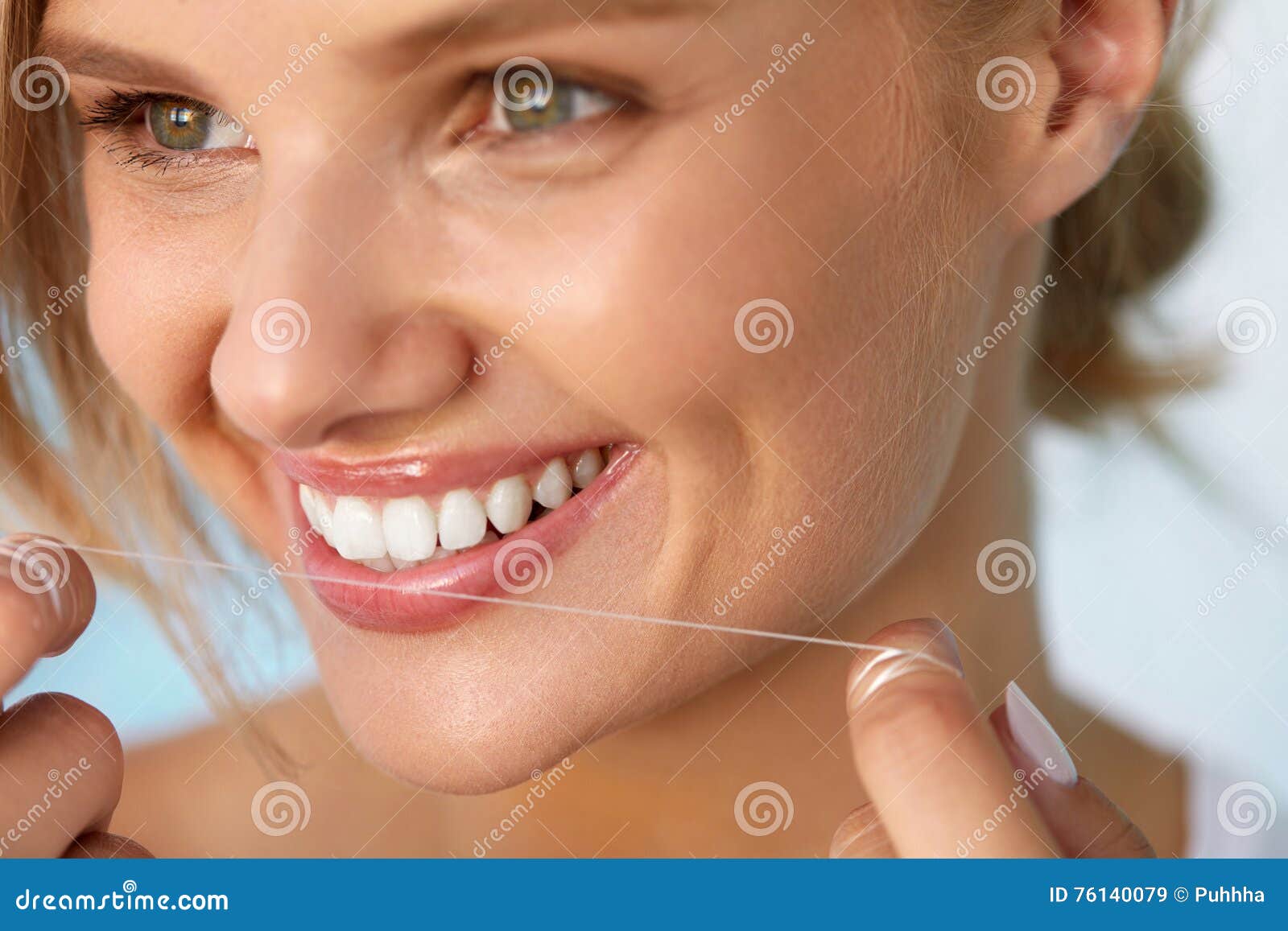 dental health. woman with beautiful smile flossing healthy teeth