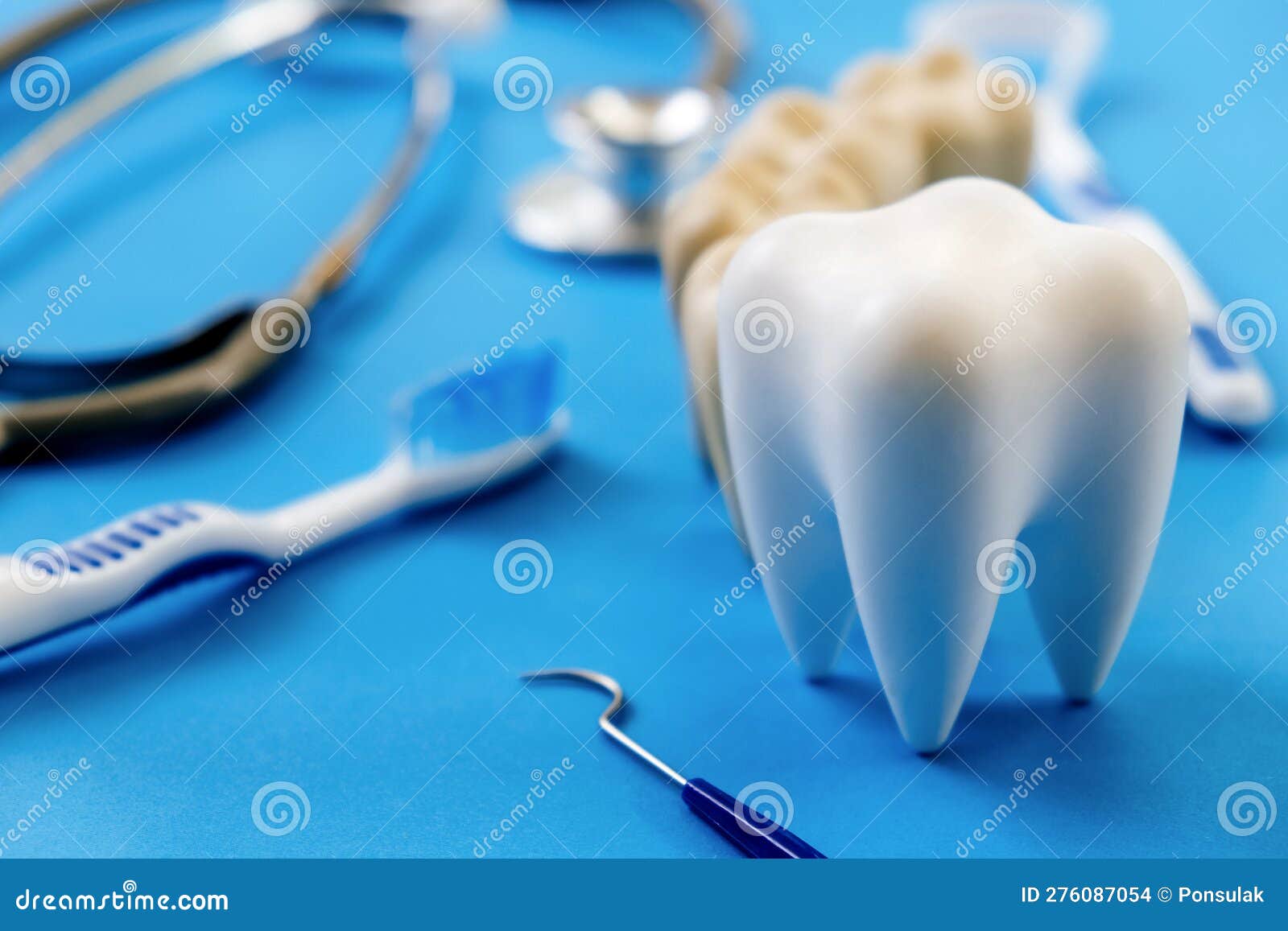 Dental Model and Dental Equipment on Blue Background Stock Photo