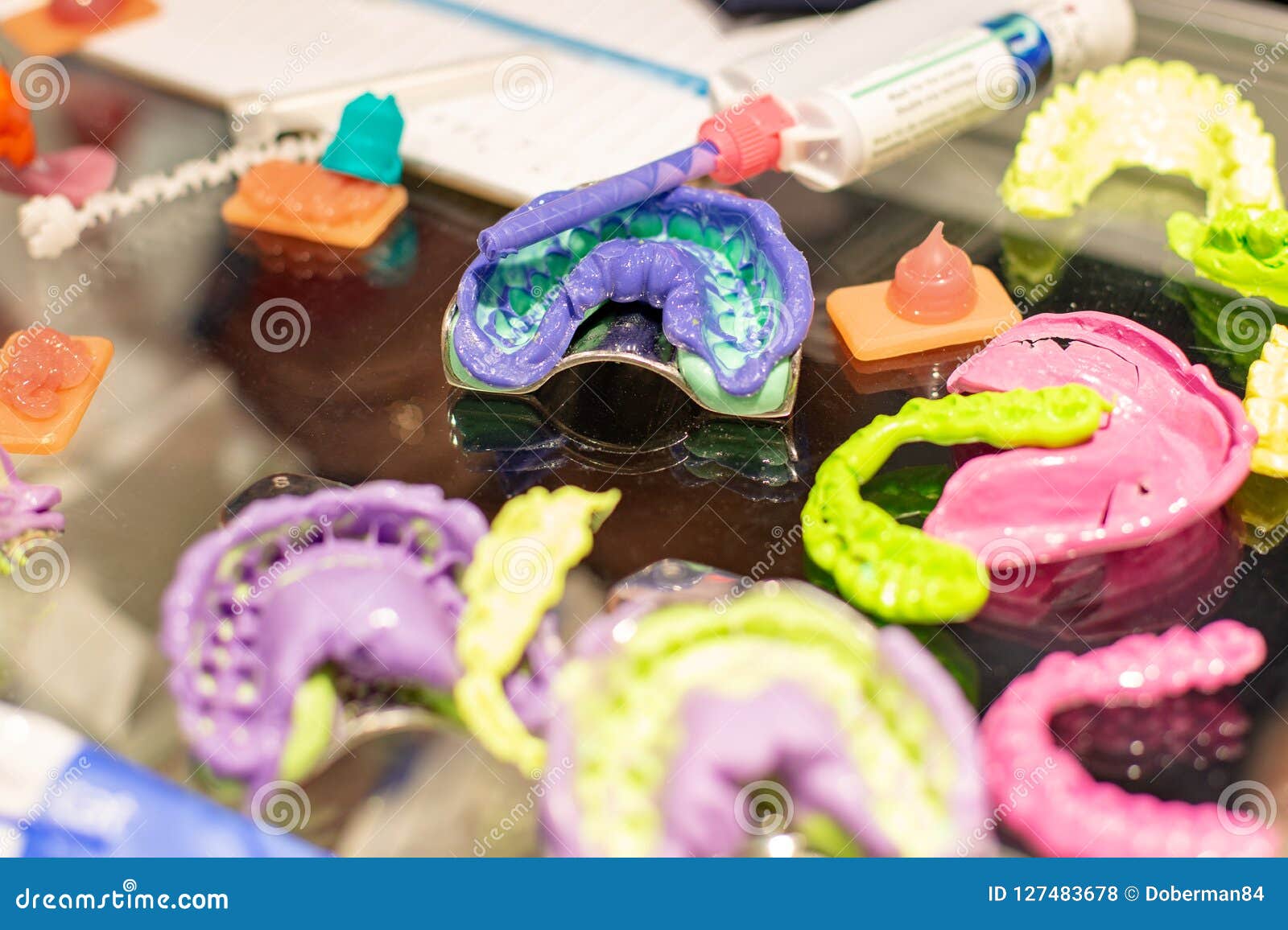 Dental Orthodontic Tools. Multicolored Device for Making a Molded