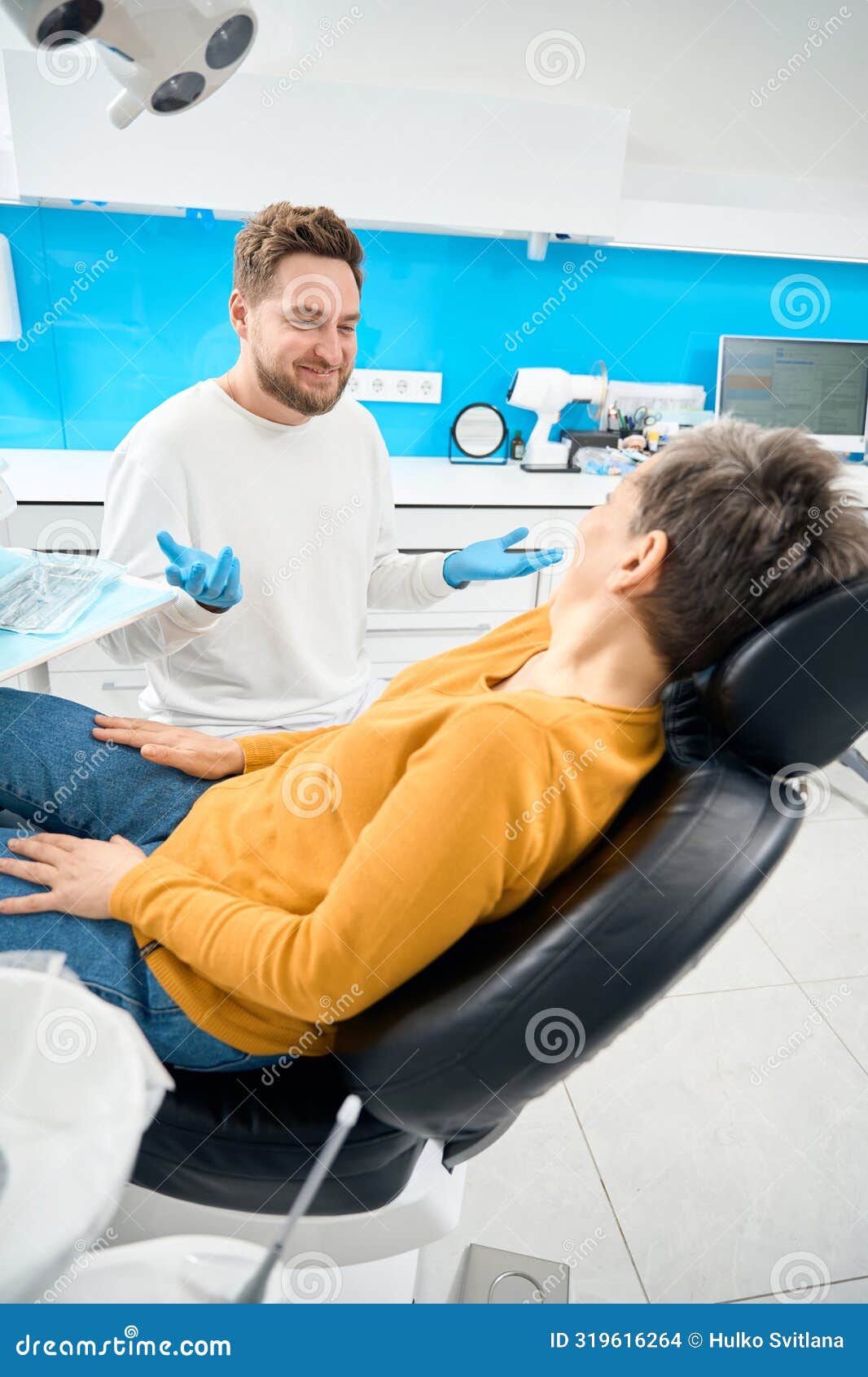 Dental Practitioner Listening To His Nervous Patient after Visual ...