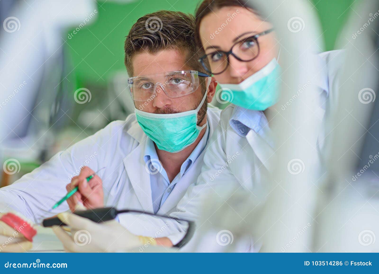 Dental Prosthesis, Dentures, Prosthetics Work. Prosthetics Hands while Working on the Denture