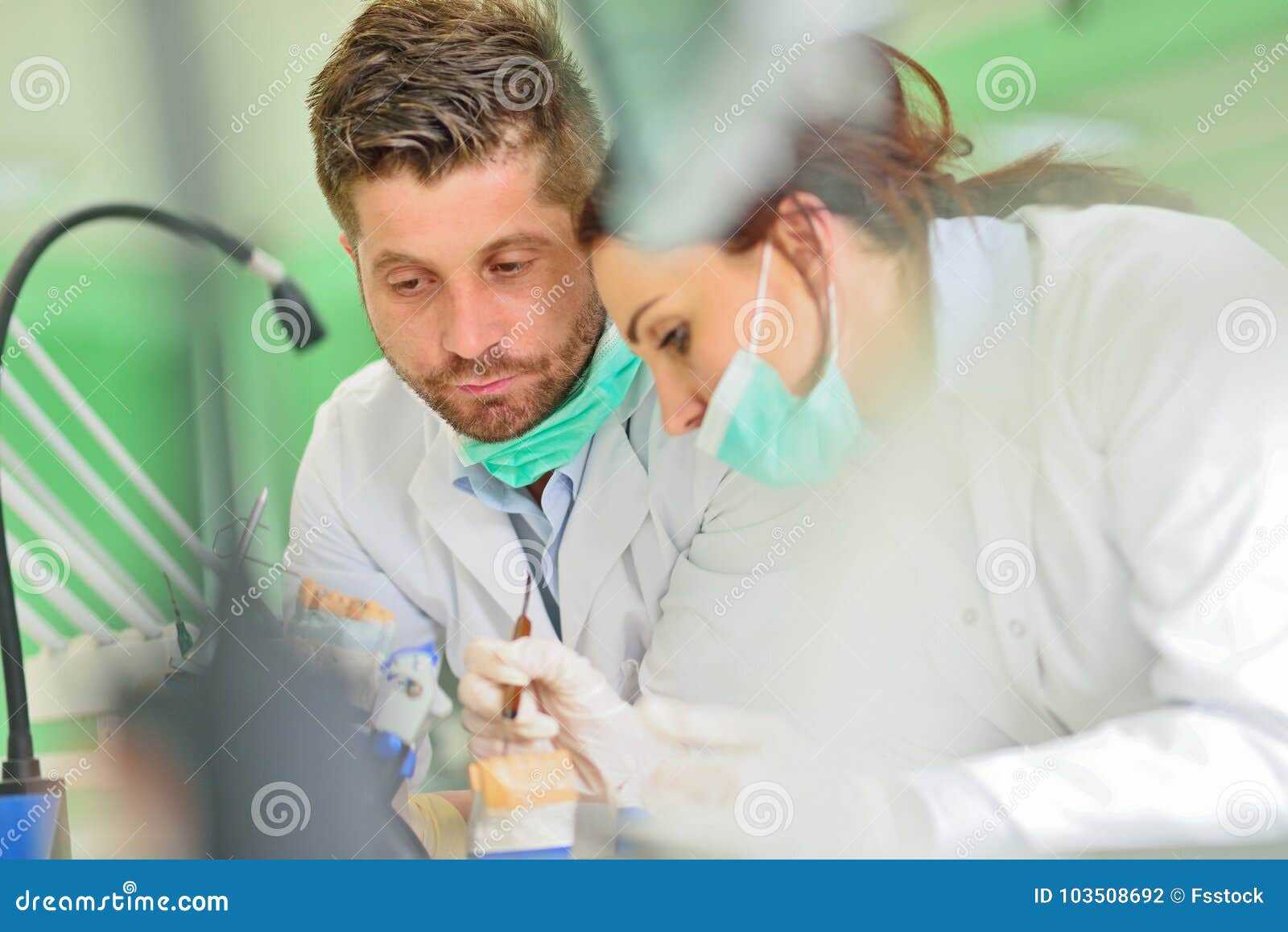 Dental Prosthesis, Dentures, Prosthetics Work. Prosthetics Hands while Working on the Denture