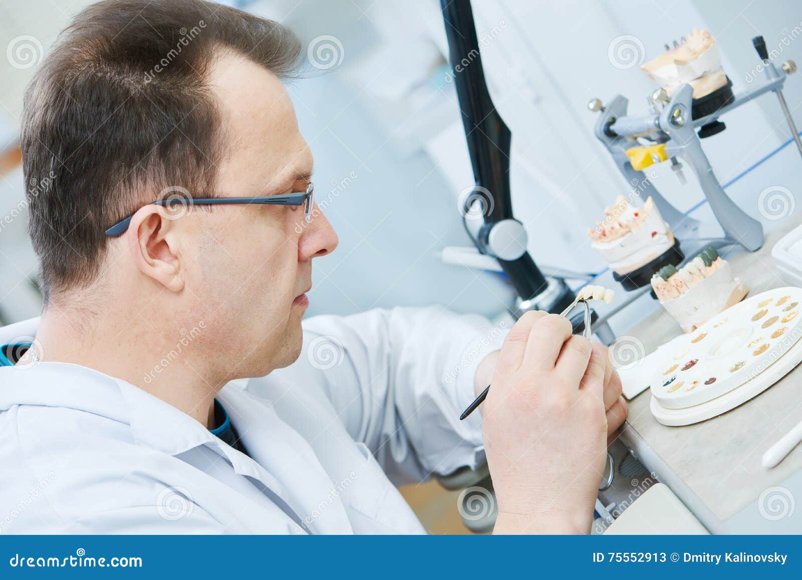 Dental prosthesis work stock image. Image of construction 75552913