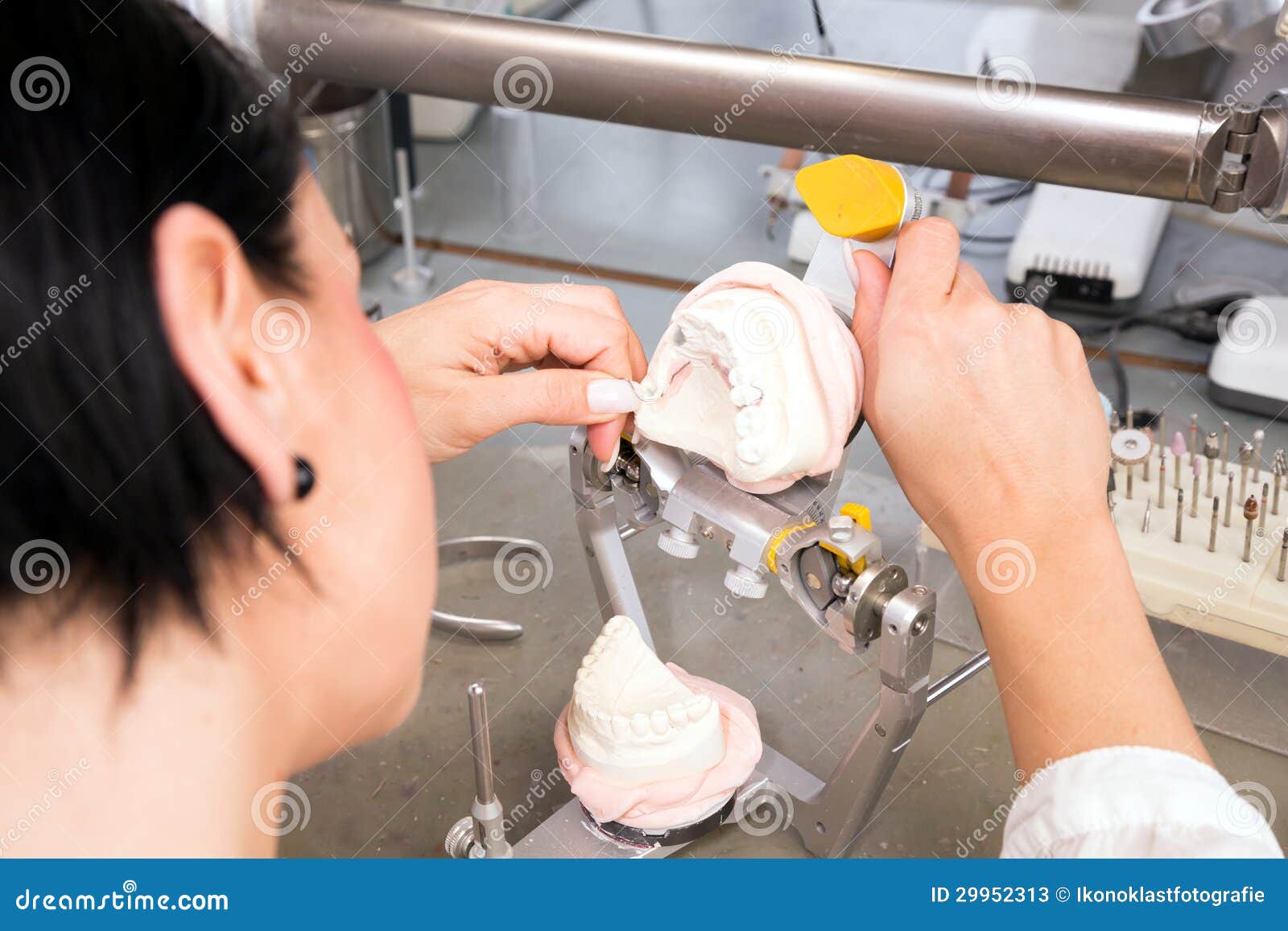 A Dental Technician Working on a Mold in a Laboratory Stock Image