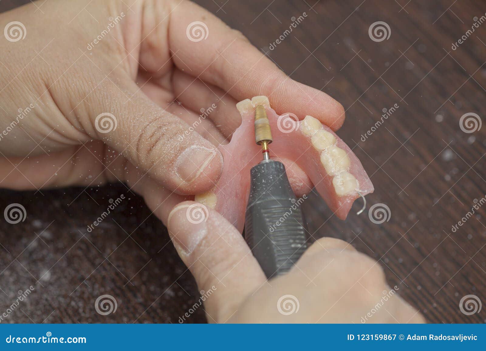 Dental Technician Make Denture Prothesis with Motor Tool in Dent Stock