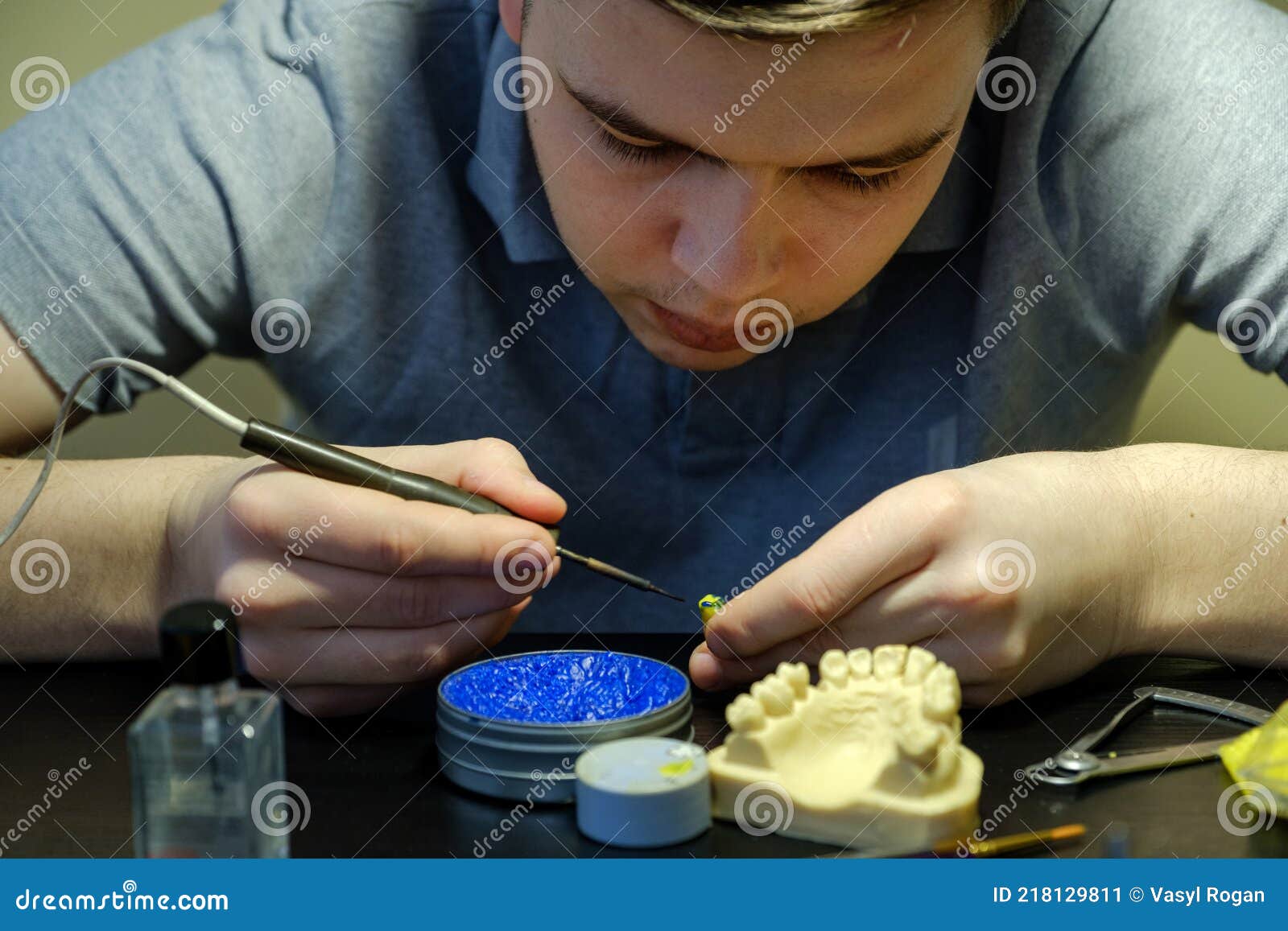 Dental Technician Modelling Tooth Crowns with Hot Wax Stock Image
