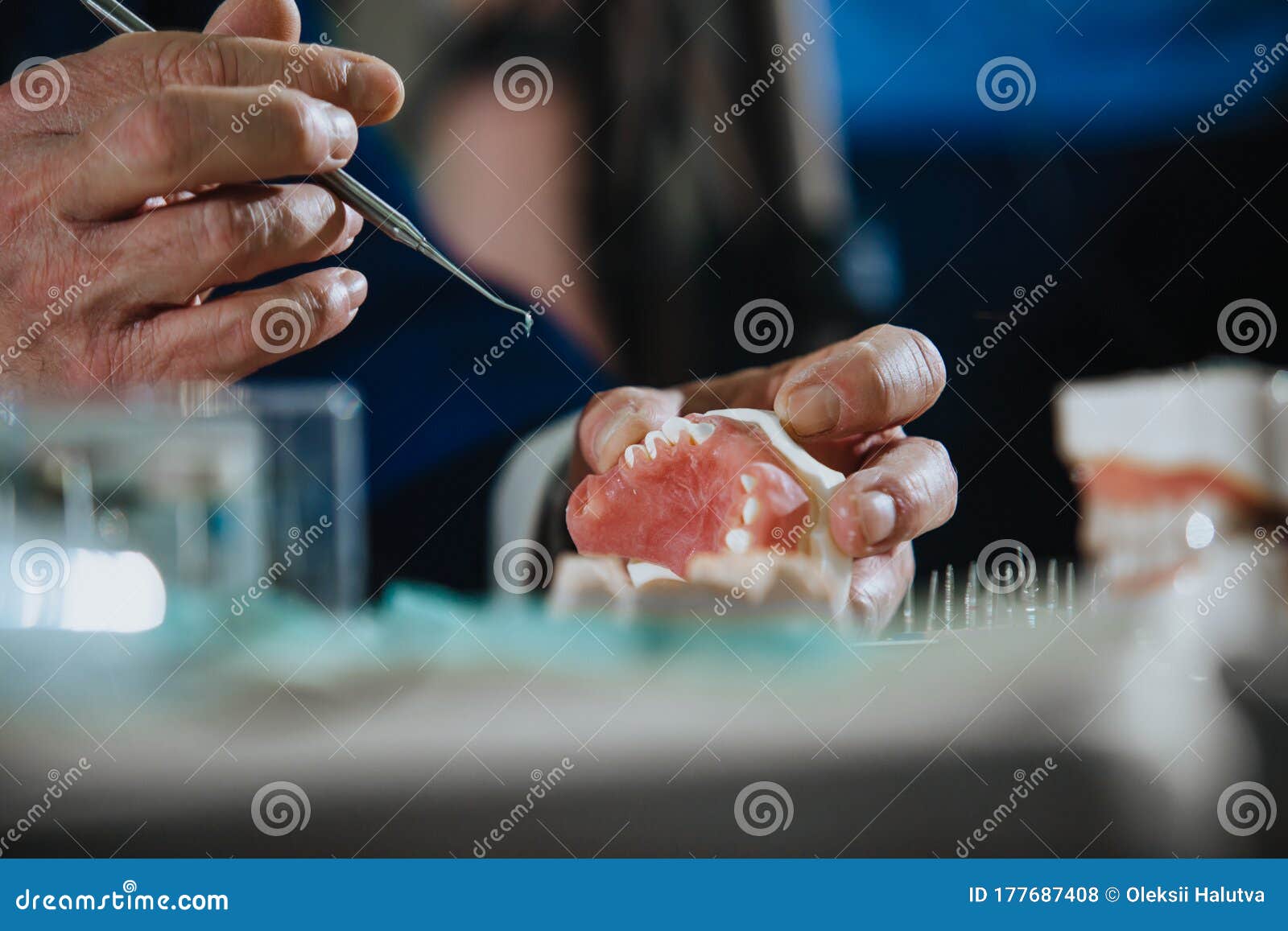 A Dental Technician Processes a Cast of the Jaw. Stock Photo Image of