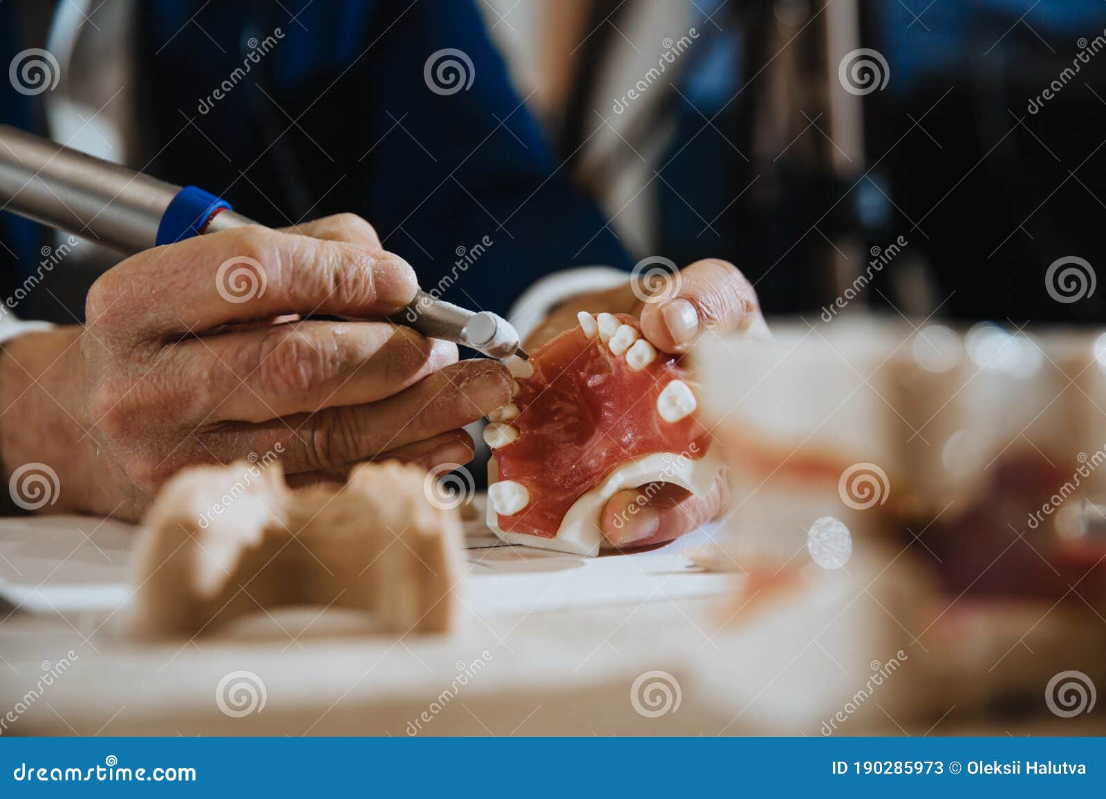 A Dental Technician Processes a Cast of the Jaw Stock Image Image of