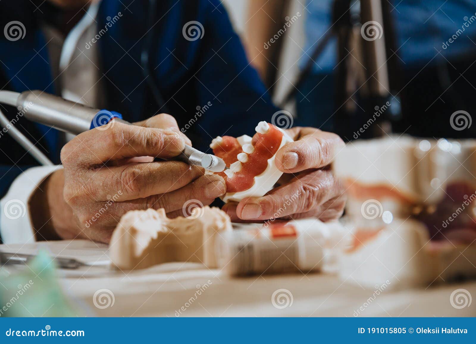 A Dental Technician Processes a Cast of the Jaw Stock Image Image of
