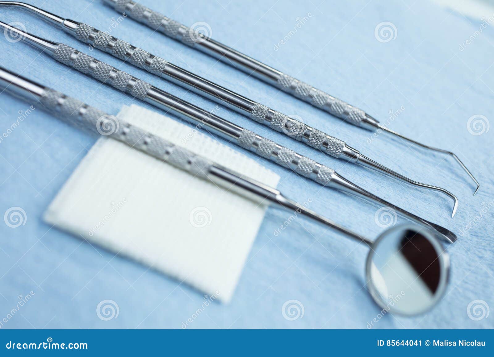 Dental Tools and Gauze on a Paper Lined Tray Stock Image Image of instrument, tooth 85644041