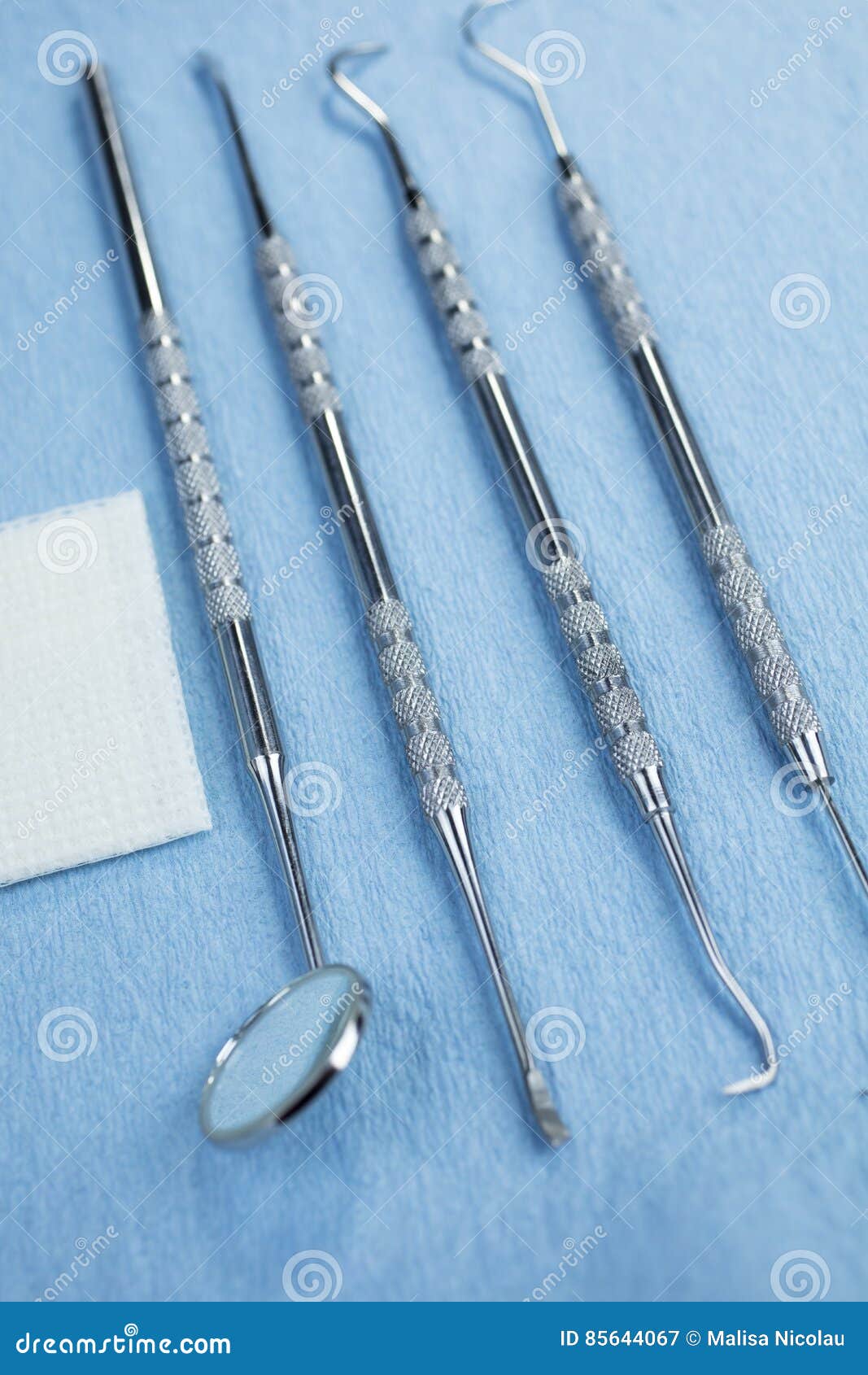 Dental Tools and Gauze on a Paper Lined Tray Stock Image Image of instrument, probe 85644067