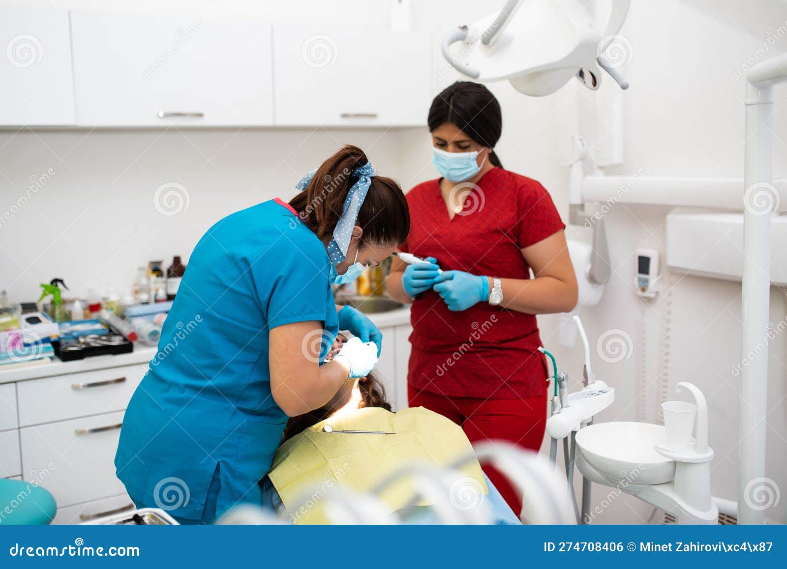 dentist appointment at a dental clinic, placing braces locks on the teeth and pulling the archwire to fix it