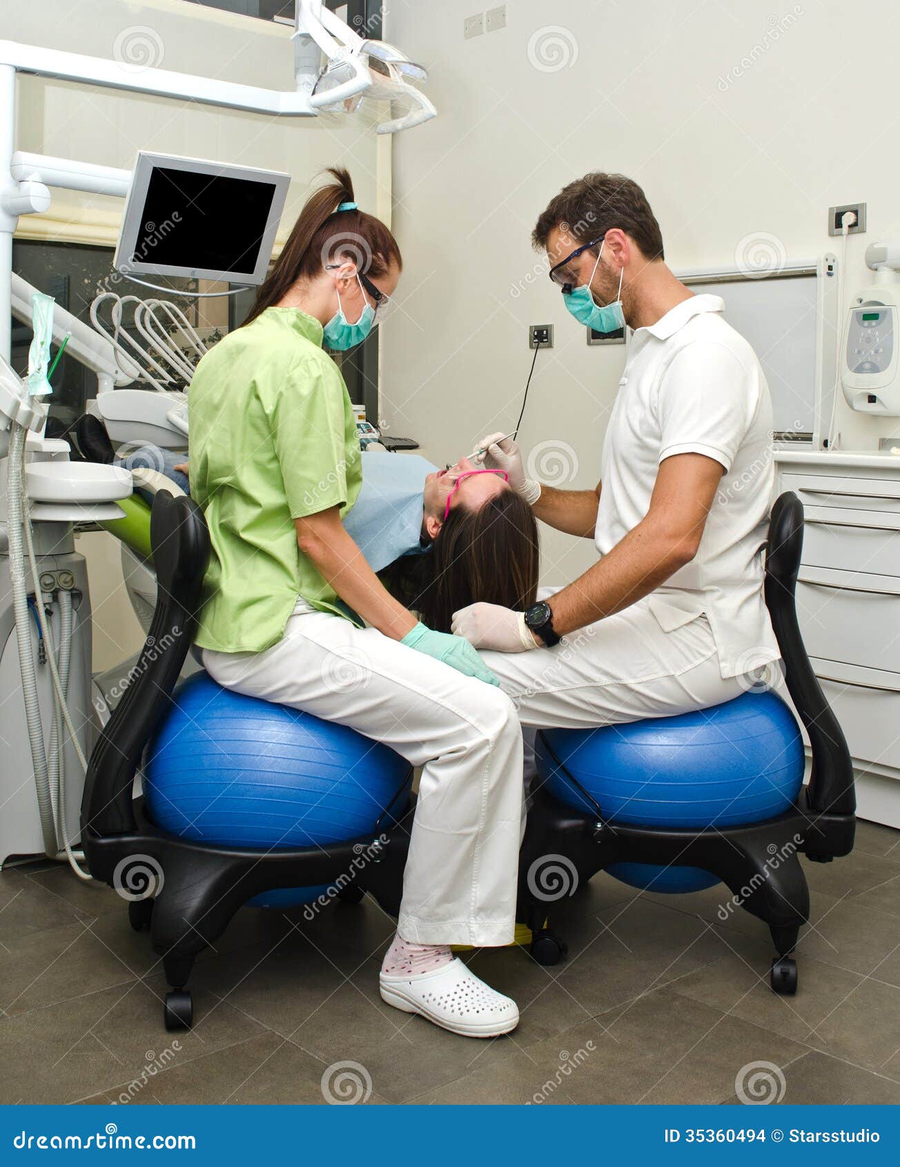 Dentist, Assistant and Patient in Dental Clinic Stock Photo Image of