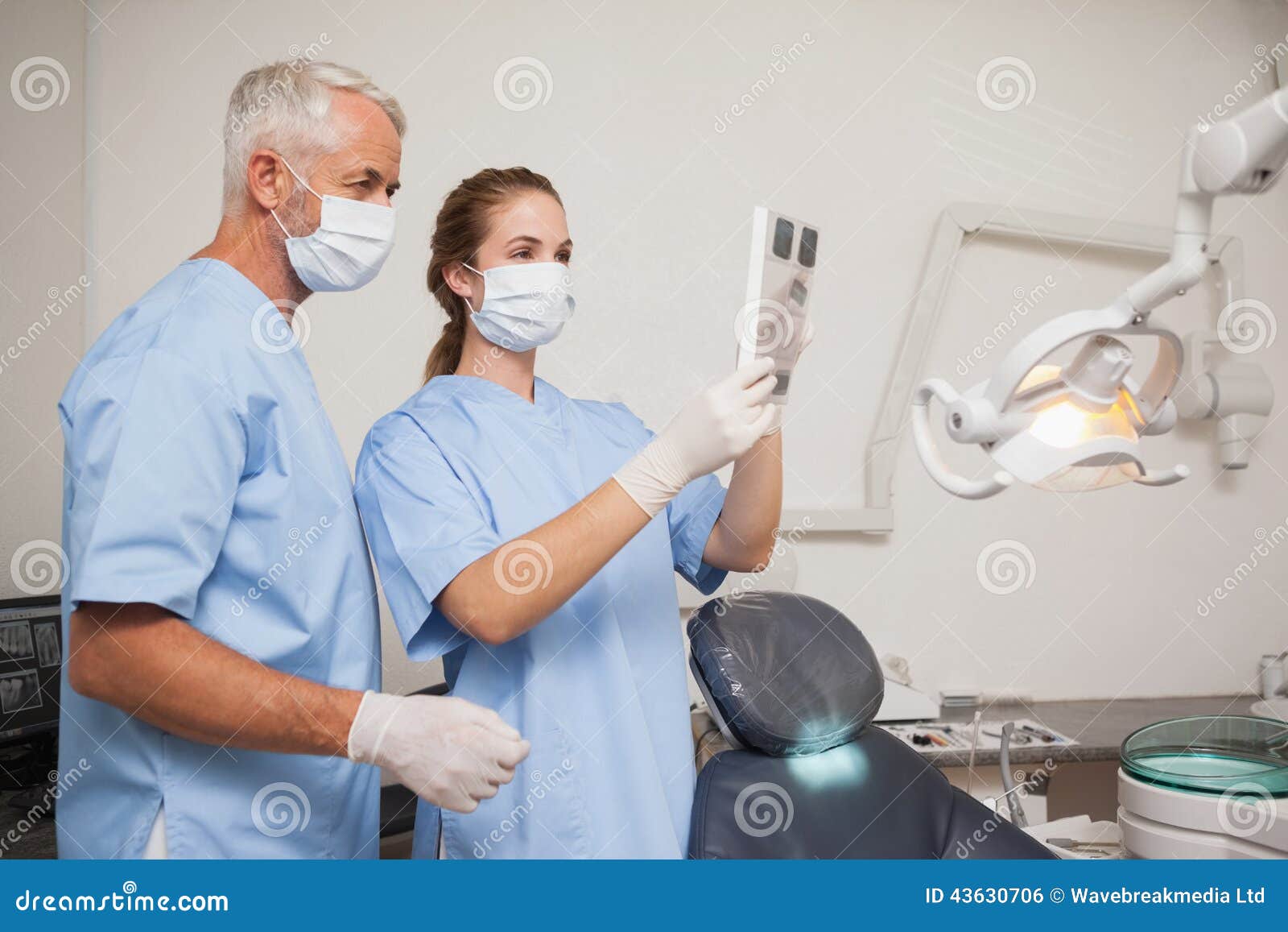 Dentist and Assistant Studying Xrays Stock Photo Image of length