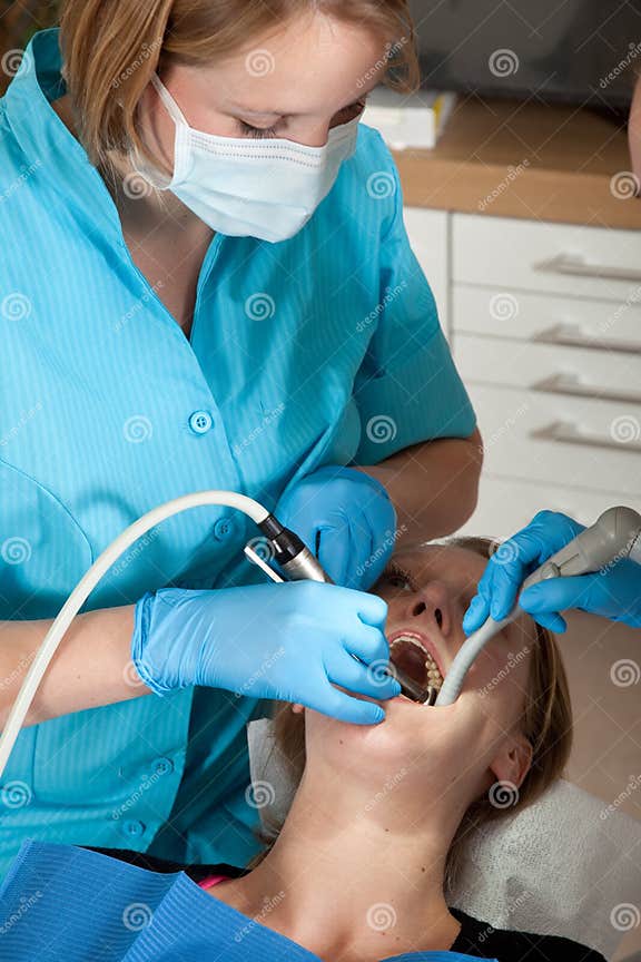 Dentist drilling a cavity stock photo. Image of oral 13977346