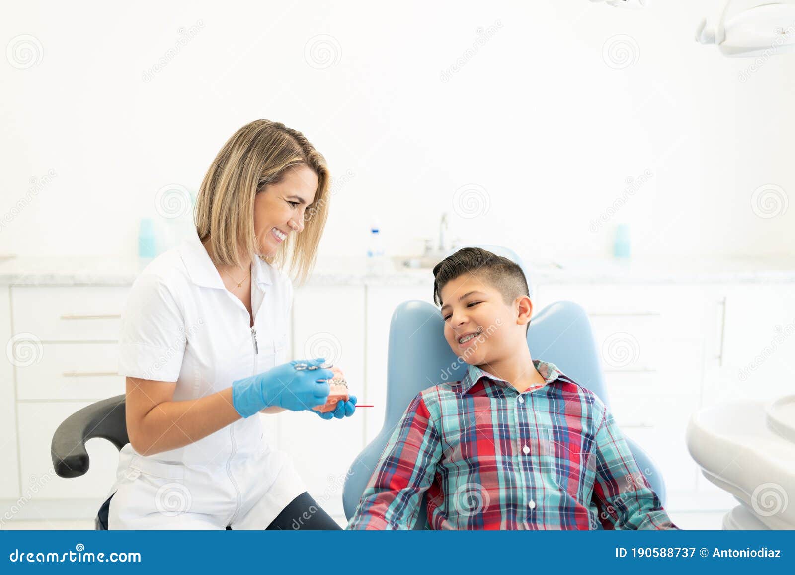 dentist explaining patient at clinic