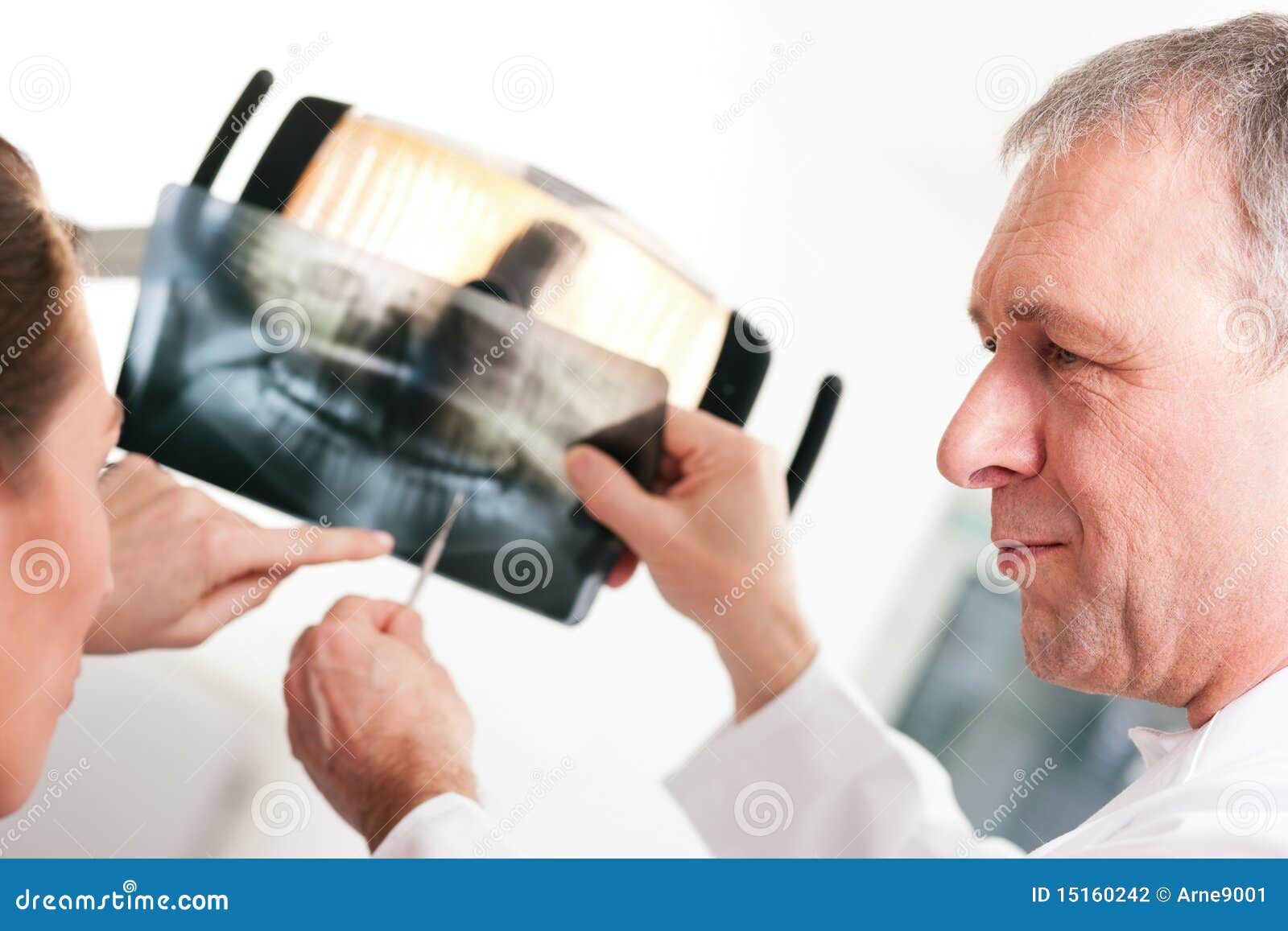 dentist explaining x-ray to patient