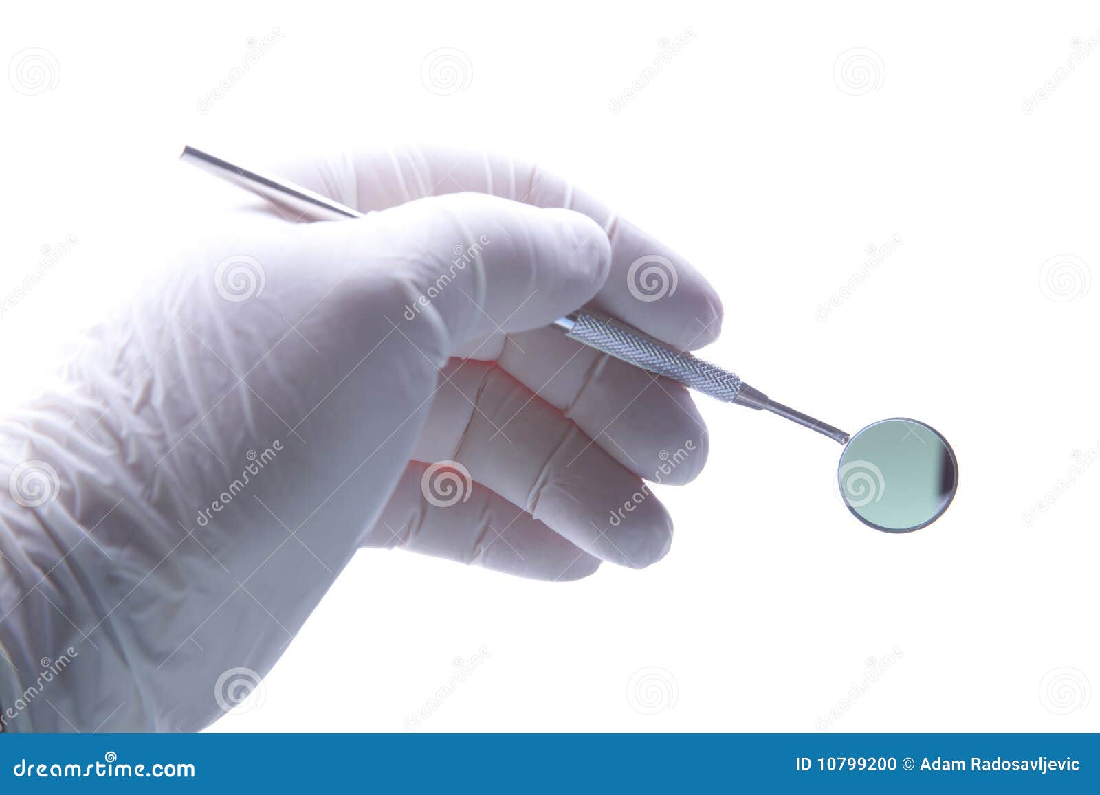 dentist hand gloved hold angled mirror