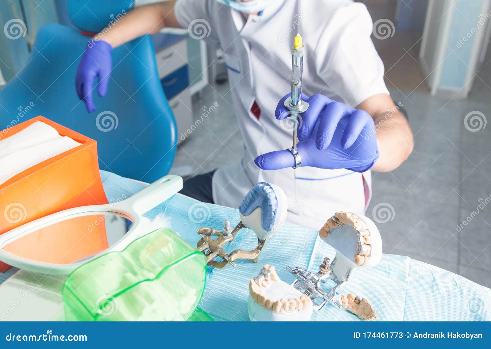Dentist Holding Syringe in the Dental Office Stock Image Image of