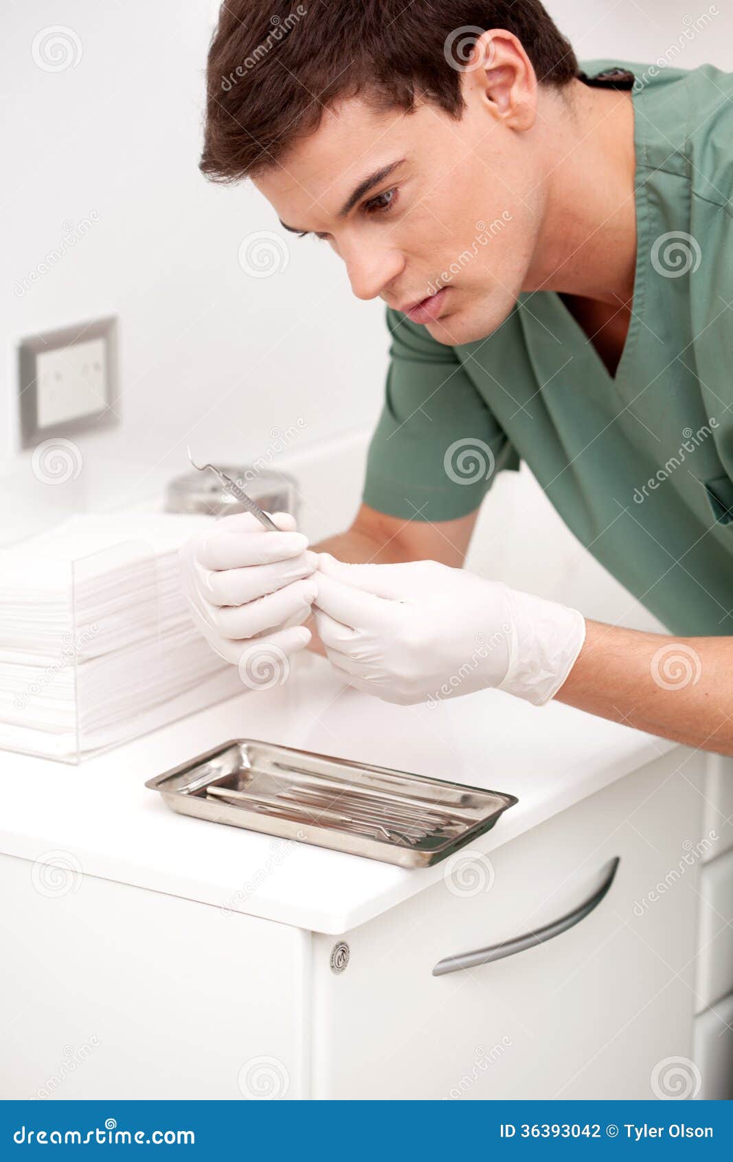 Dentist Inspecting Sterile Tool Stock Photo Image of doctor, dentist