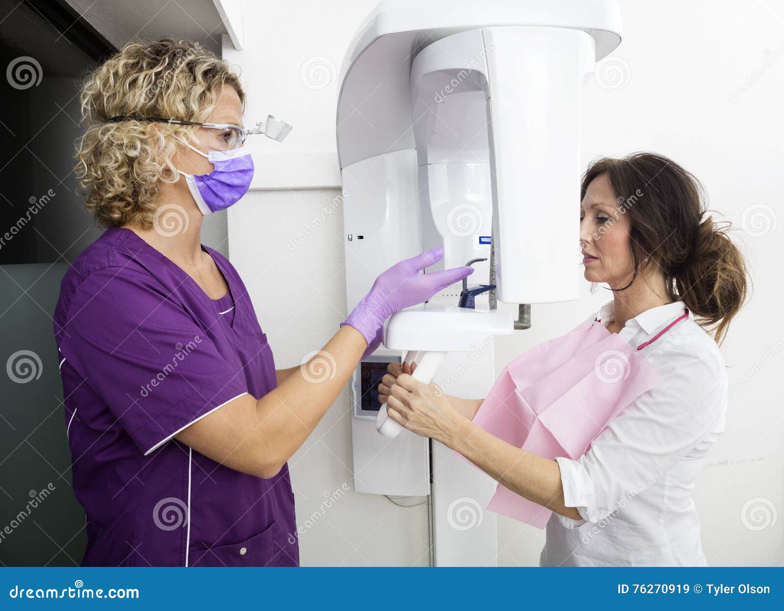Dentist Instructing Patient Using Digital Panoramic Xray Machine Stock