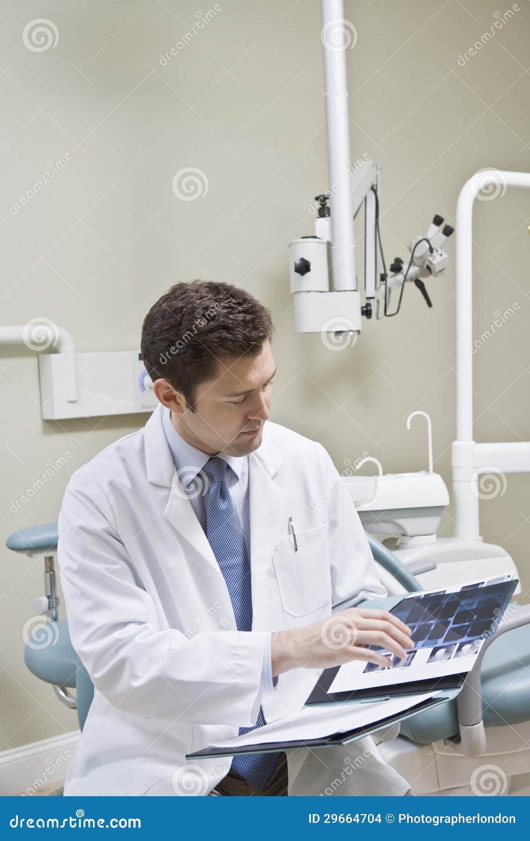 Dentist Leafing through Medical Records Stock Photo Image of folder