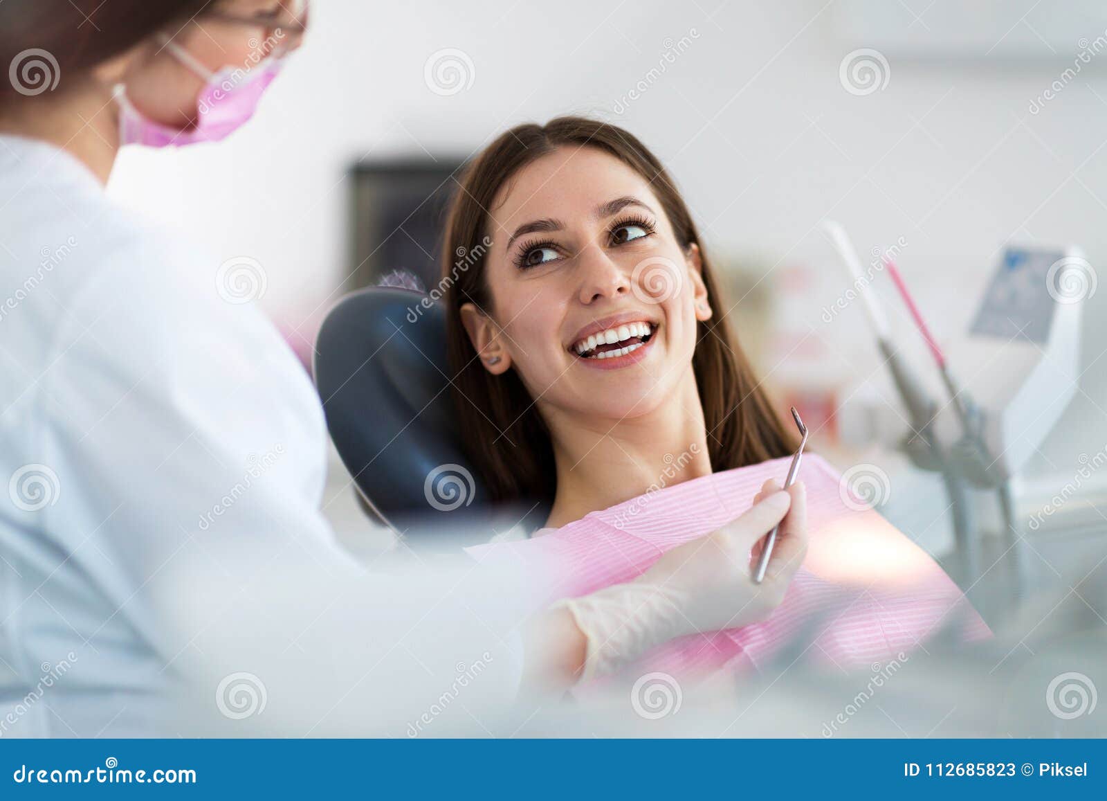 dentist and patient in dentist office
